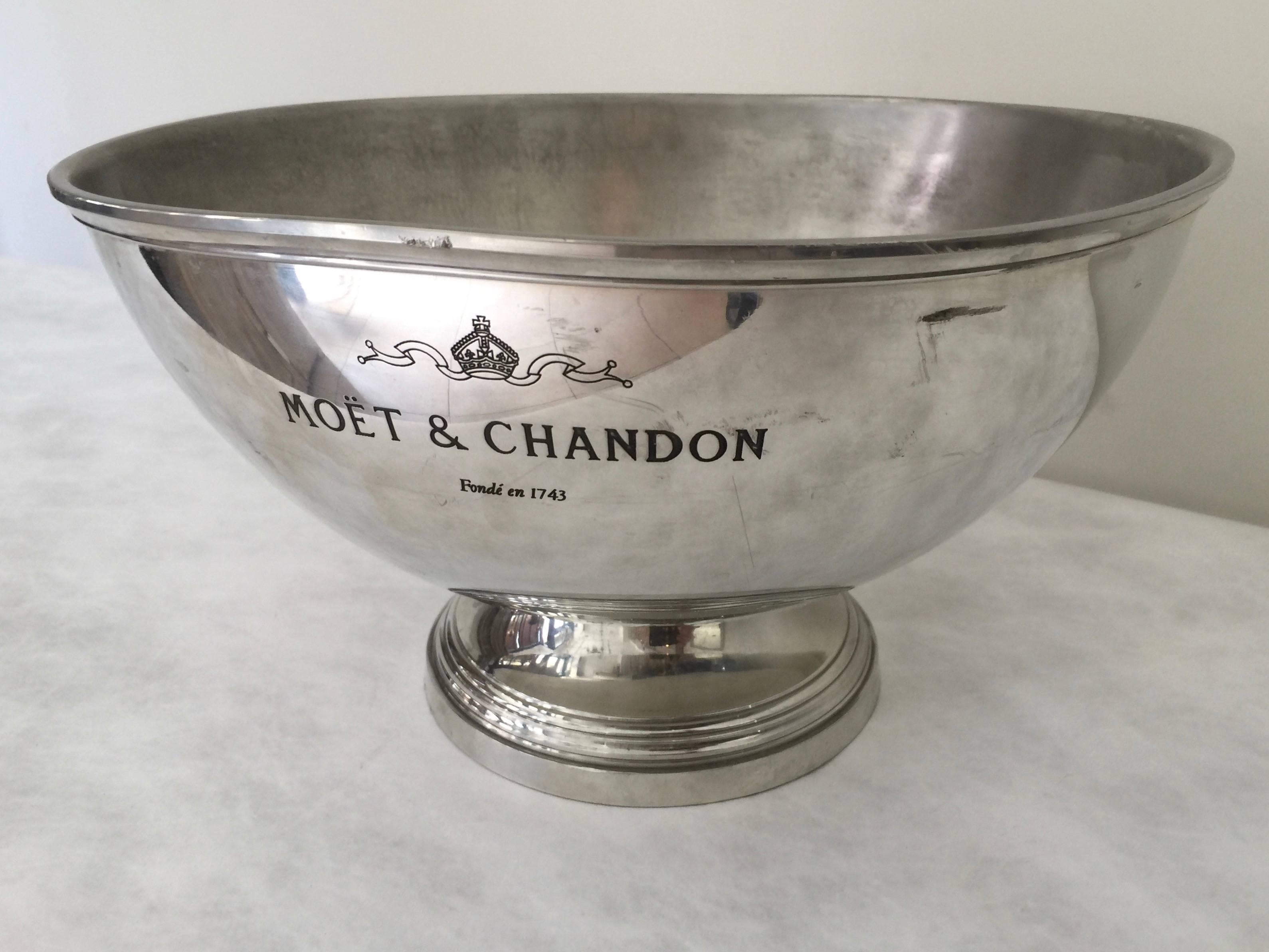 Vintage French champagne coolers from 1940-1950 in worn pewter, nickel or silver plate and feature the inscriptions along the sides 