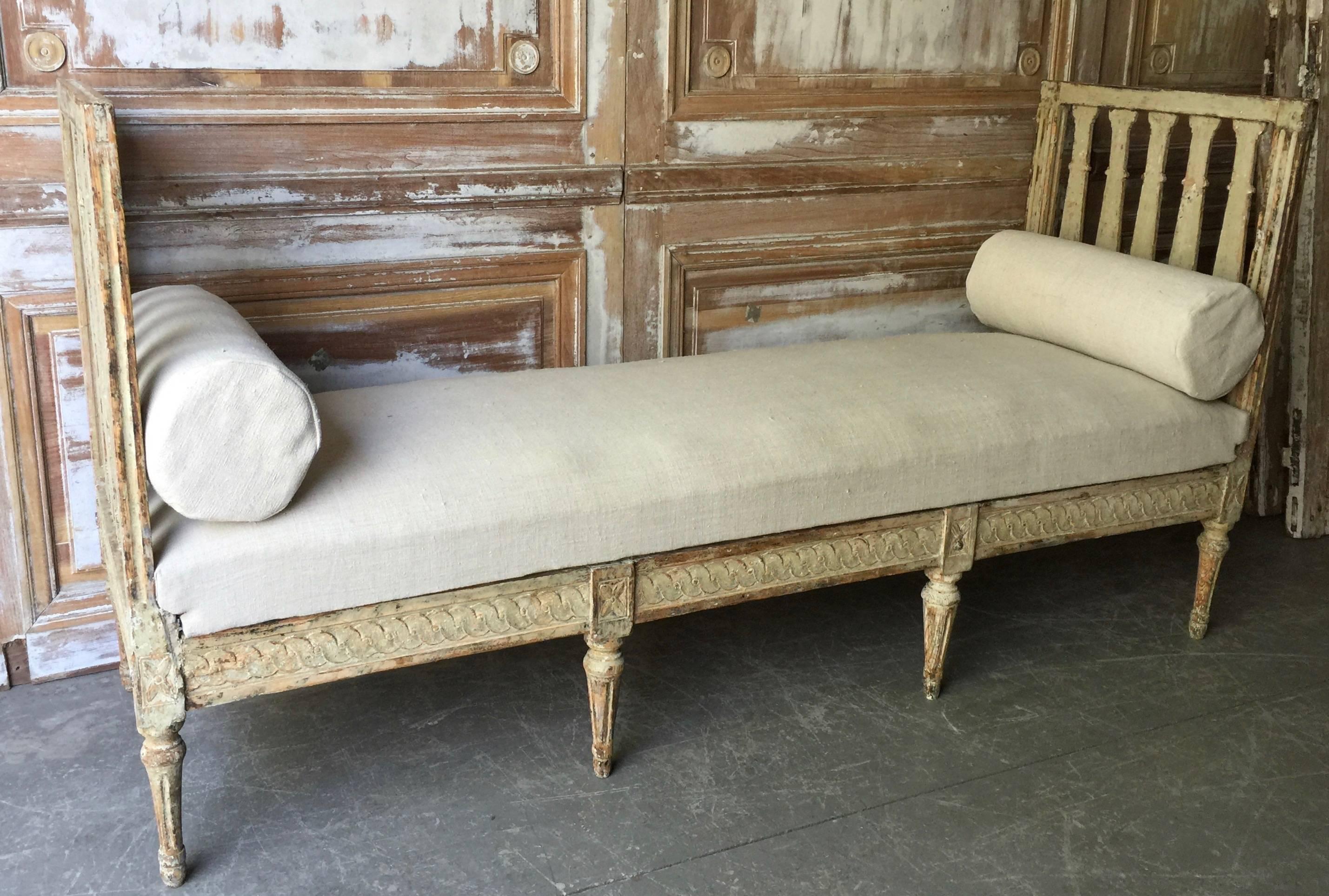 Simple, elegant, richly carved, late 18th century Swedish period Gustavian daybed witch three sides are detailed in Guilloché carvings and rosettes on beautifully carved tapered legs - all retaining original time worn patina. Upholstered in