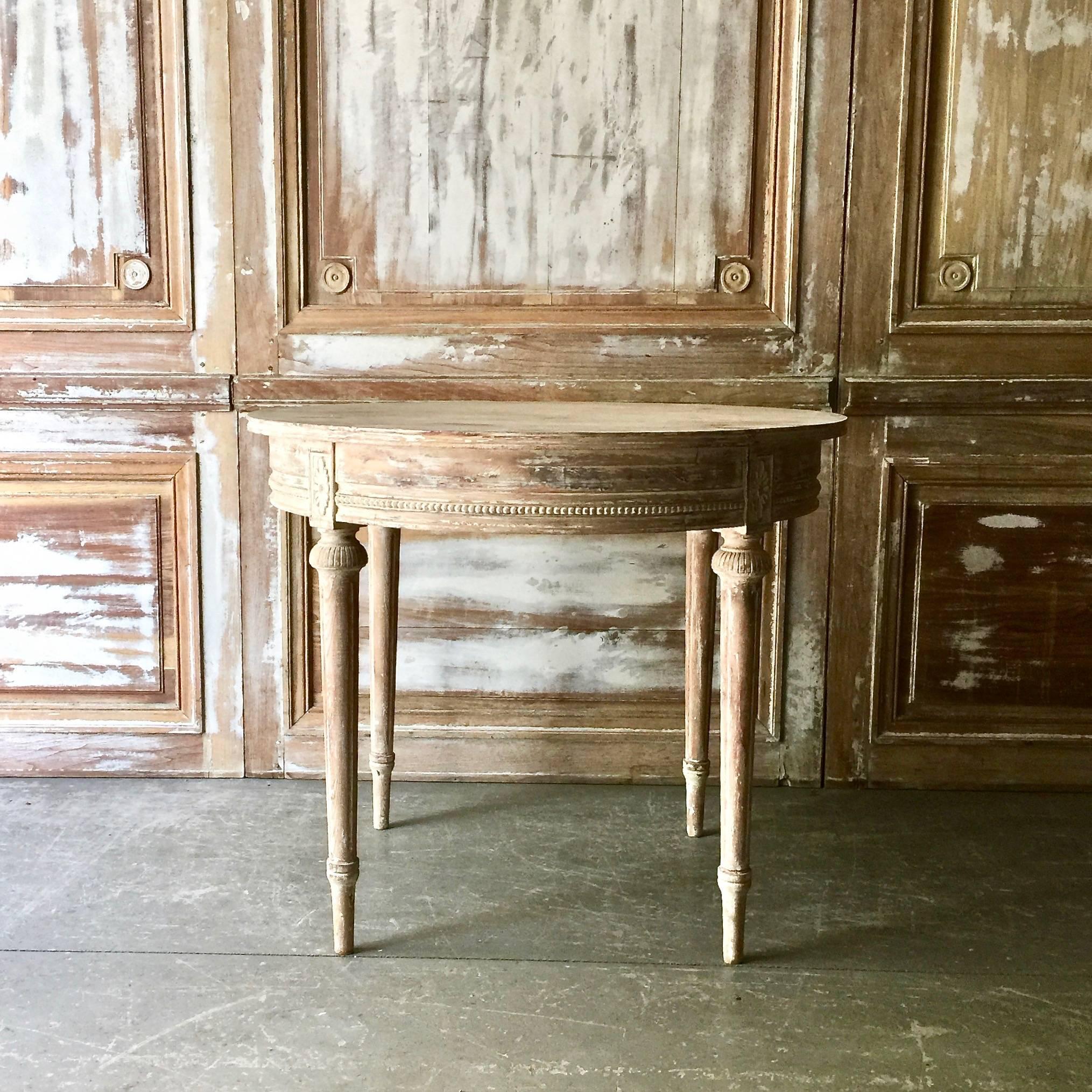 19th century classically elegant Swedish Gustavian style round table with simple bead string carved apron, richly carved tapering legs with florets, in time worn cream patina.
Sweden, circa 1880.
Here are few examples surprising pieces and