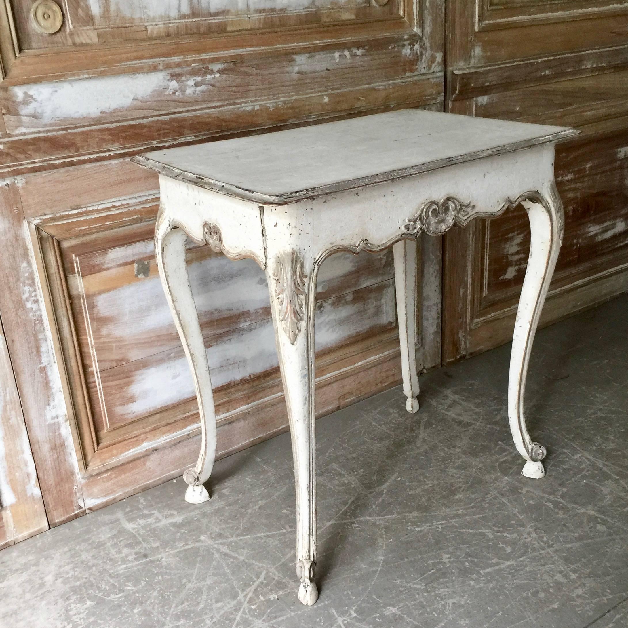 A charming Louis XV style side table has slender cabriole legs with carved knees, and a carved flower motif centering all four sides of shaped apron.
One drawer on one side, France, circa 1860.
Surprising pieces and objects, authentic, decorative