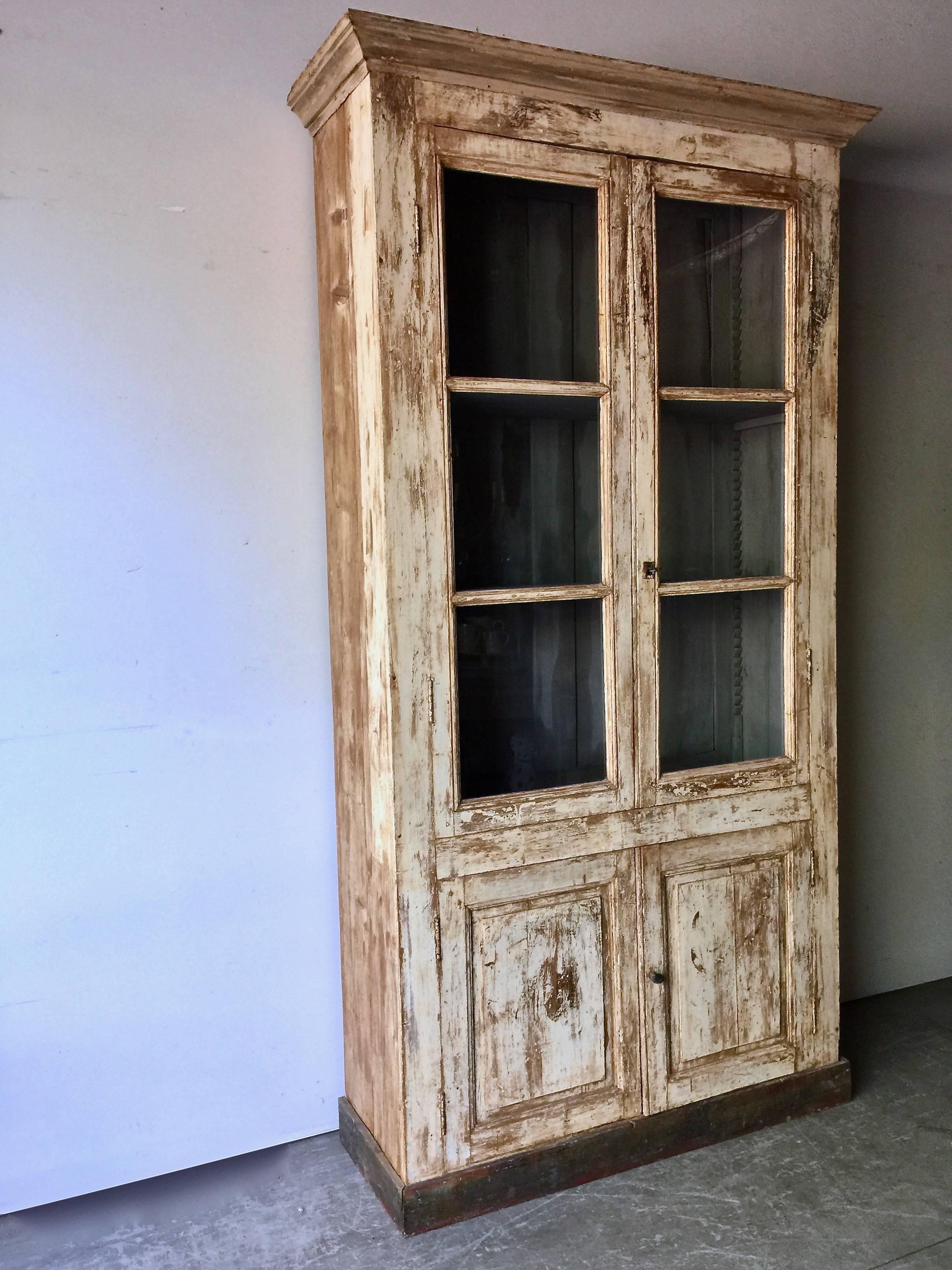 Painted Bibliothèque in original worn paint with three adjustable selves on two-door storage cabinet. Inside paint later,
France, circa 1890.
Over all measurement are including cornice.
Please see photo with two shelves and photo with three