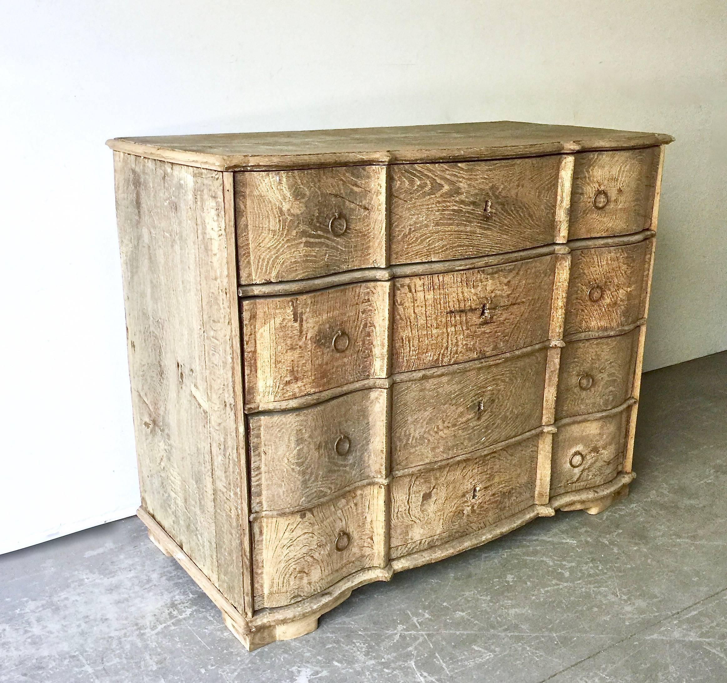18th century Danish chest with four deep drawers from late Rococo period in richly carved bleached oak with curvaceous serpentine drawer fronts, shaped top and bracket feet. 
Here are few examples surprising pieces and objects, authentic,