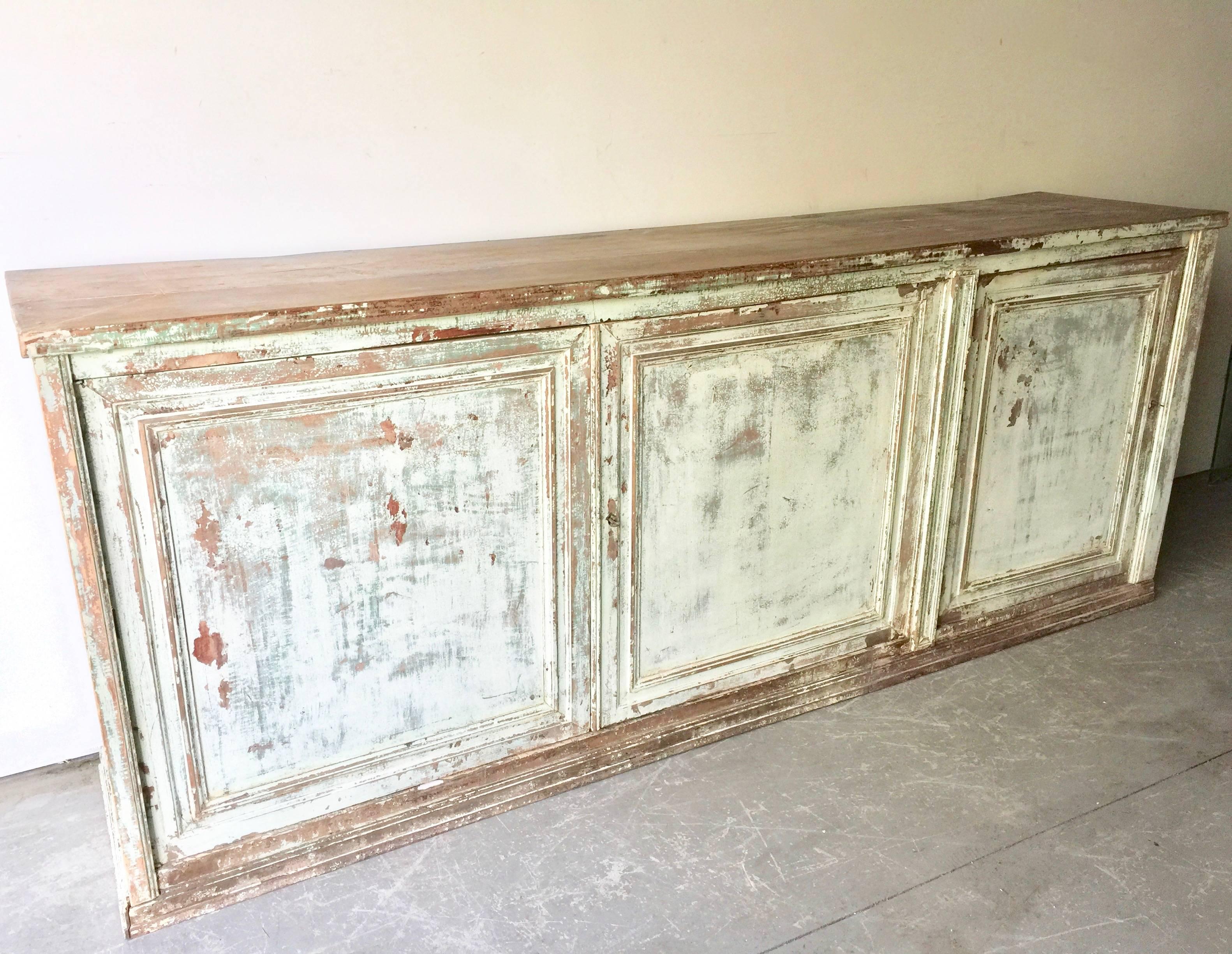 Huge, handsome 19th century painted Italian sideboard/credenza with three large panelled doors with natural worn oak top. Brilliant color and patina.
Here are few examples. Surprising pieces and objects, authentic, decorative and rare items that you