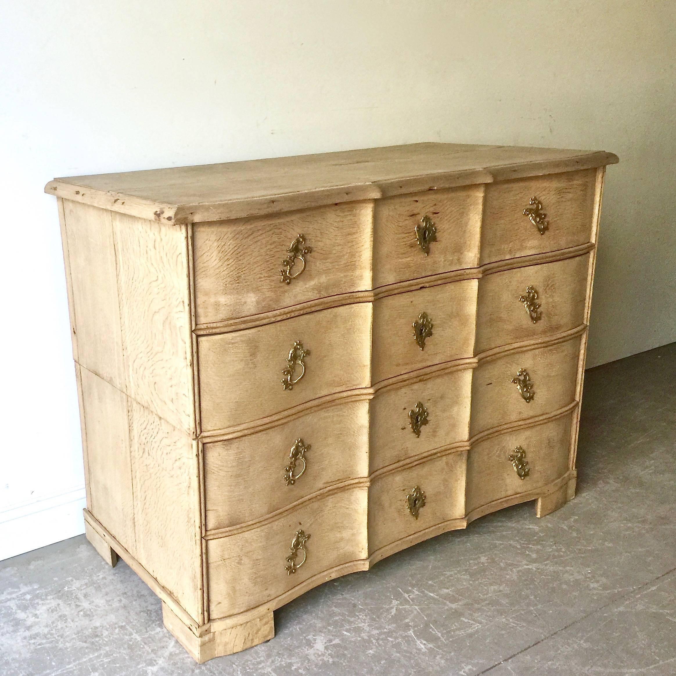 18th century Danish chest in two parts with four deep drawers from late Rococo period in richly carved bleached oak with curvaceous serpentine drawer fronts, shaped top and bracket feet. 
Here are few examples surprising pieces and objects,