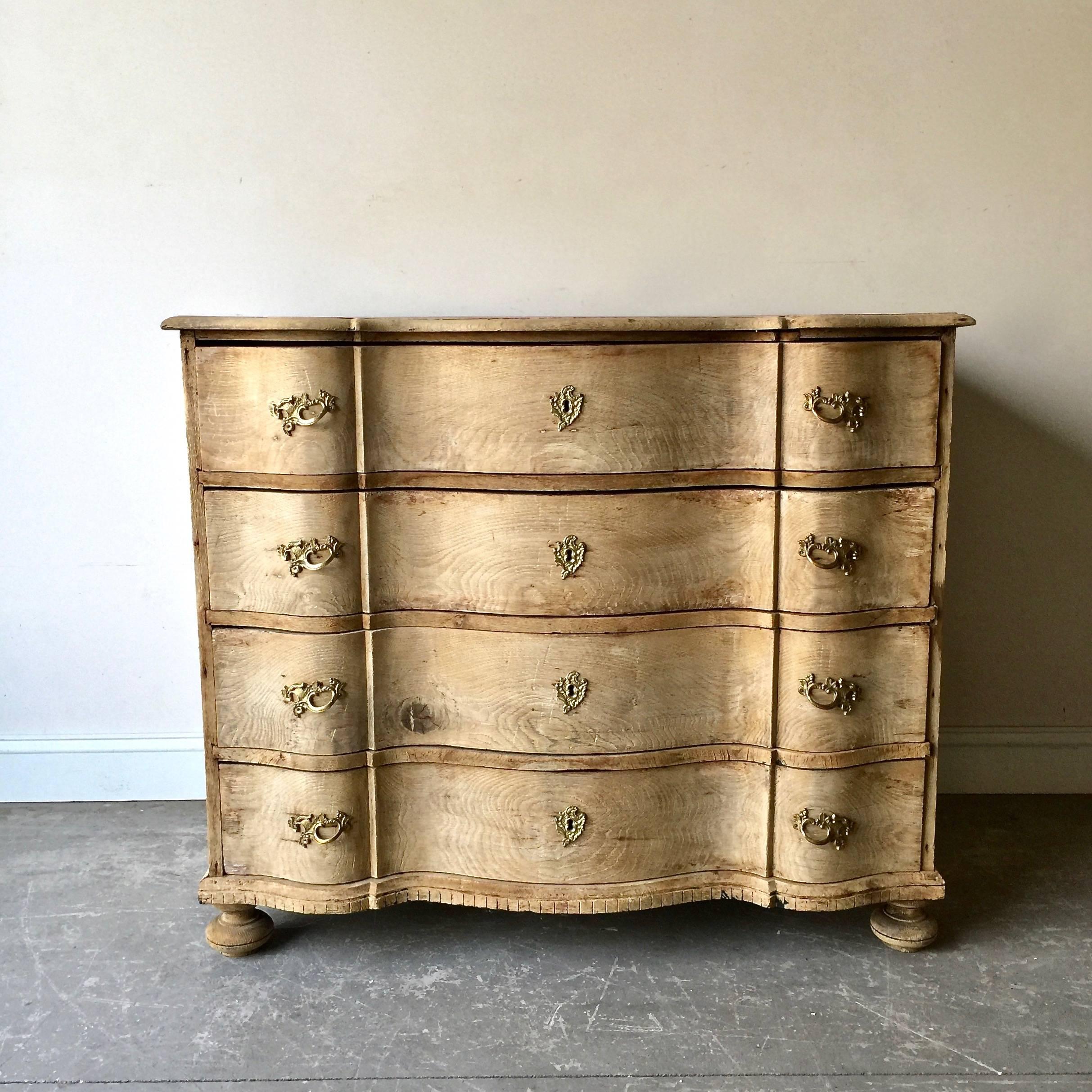 18th century Danish chest with four deep drawers from late Rococo period in richly carved bleached oak with curvaceous serpentine drawer fronts, shaped top and bun feet ... all in brilliant natural oak!
Here are few examples surprising pieces and