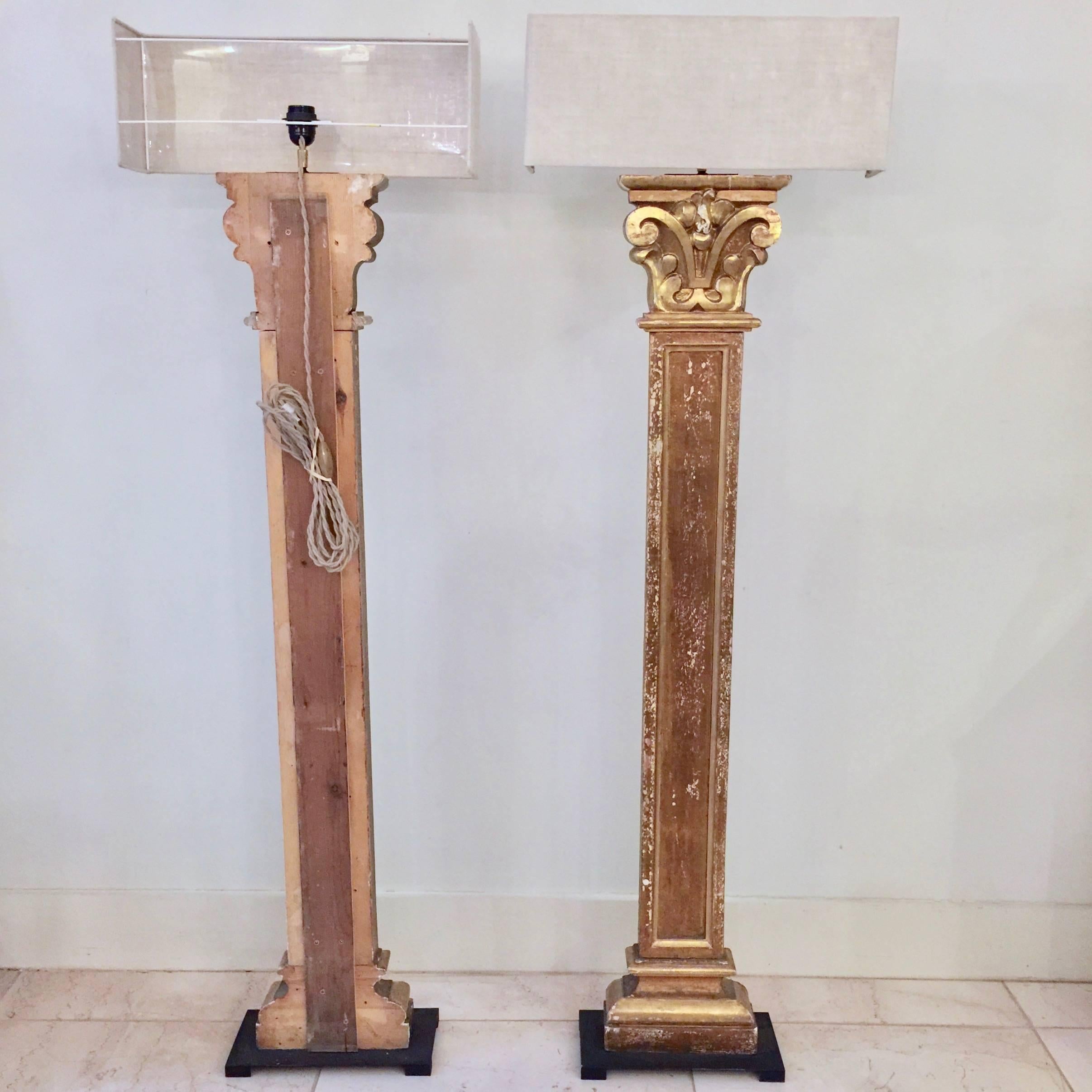 A wonderful Pair of 19th century richly carved pilaster fragment in patinated goldgilt made into floorlamps, mounted on iron base and with custom made linen shades.
 France.
Lampshade : 20