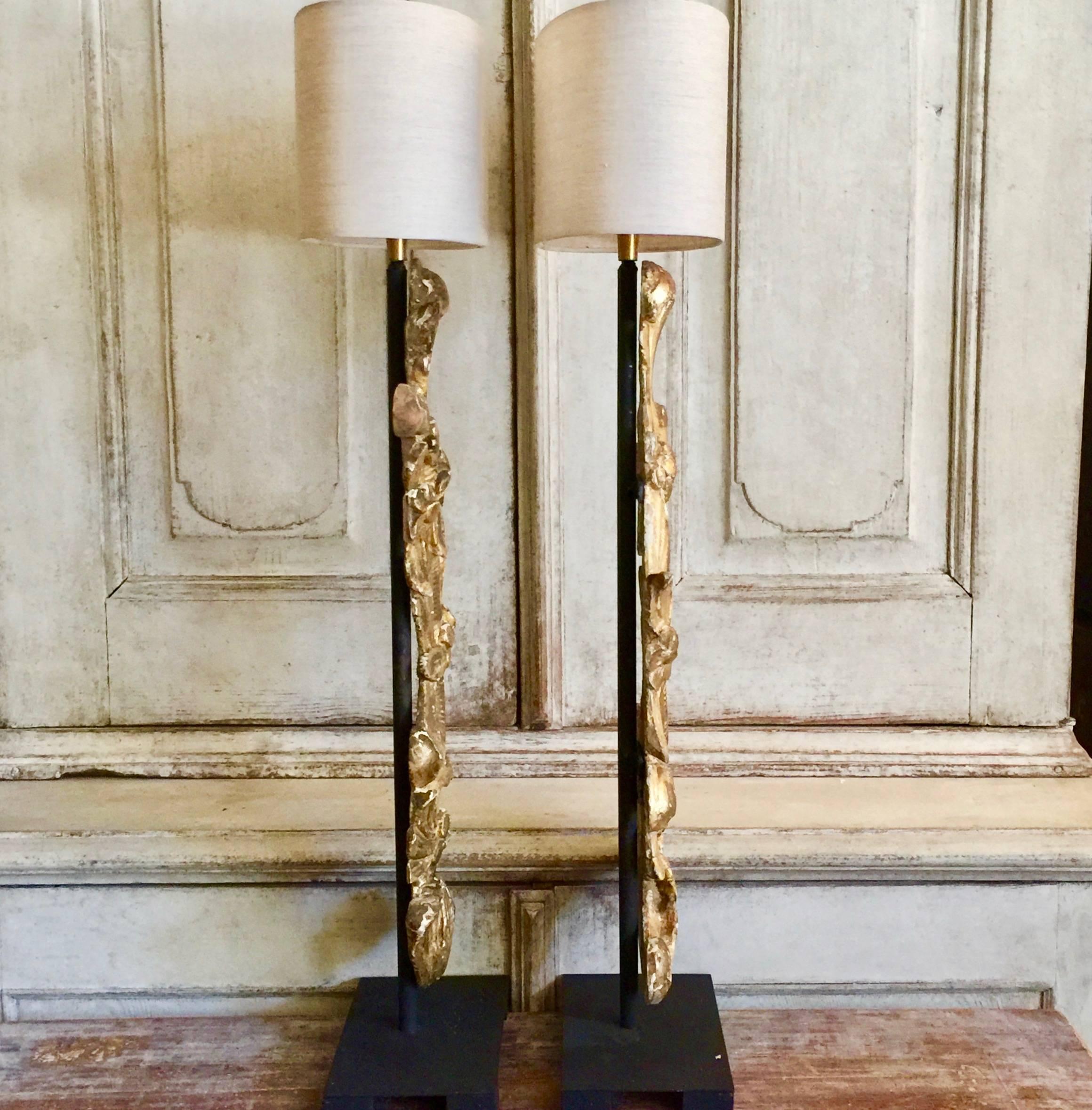 A magnificient highly decorative 19th century gold gilt fragments made into the table lamps, mounted on iron base and with custom made oval linen shades. 
France.
Shade: 12