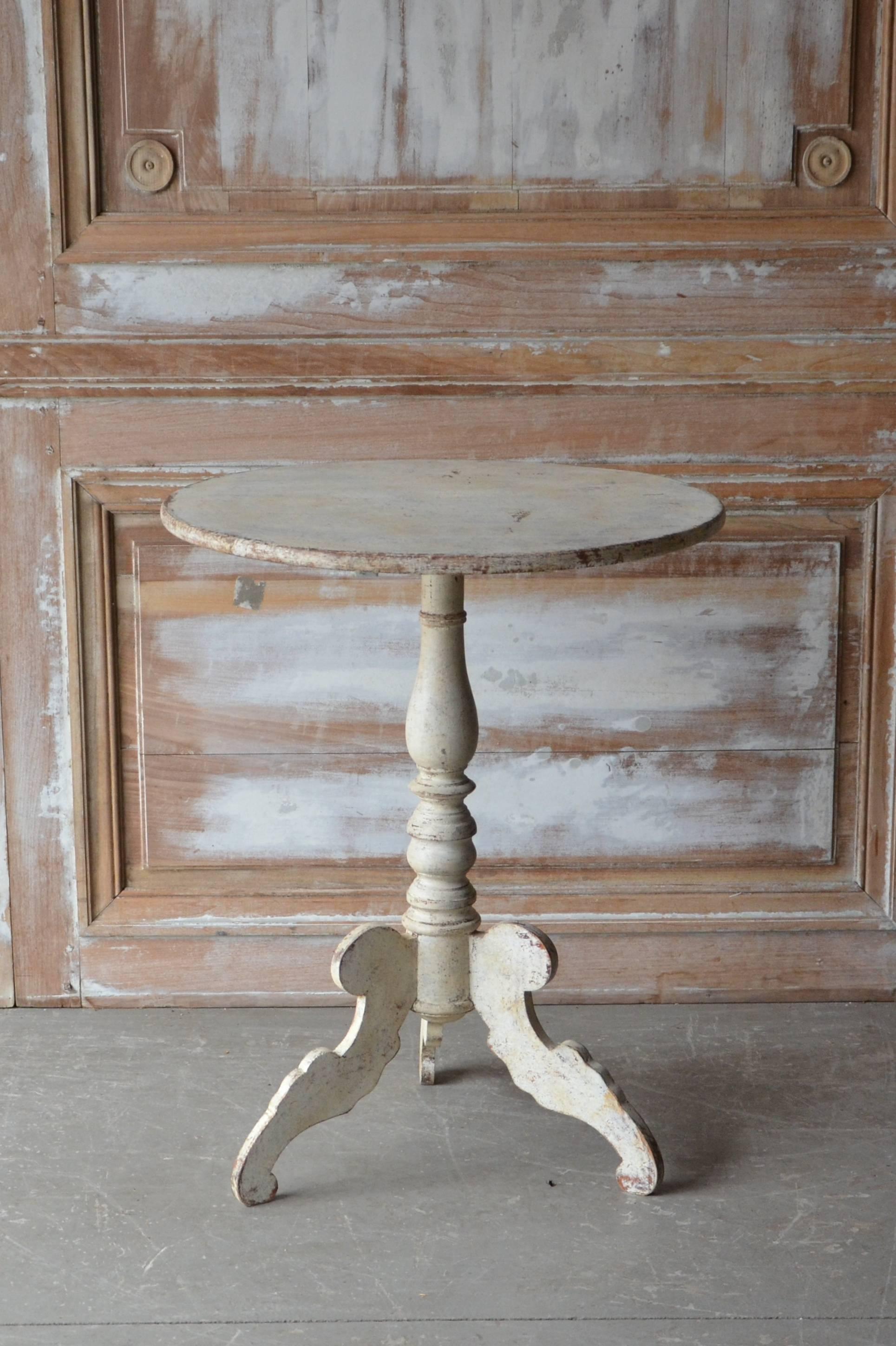 19th century Swedish tilt-top pedestal table, Karl Johan period, Sweden, circa 1830 with turned base supported by beautifully carved legs. 
Stockholm, Sweden