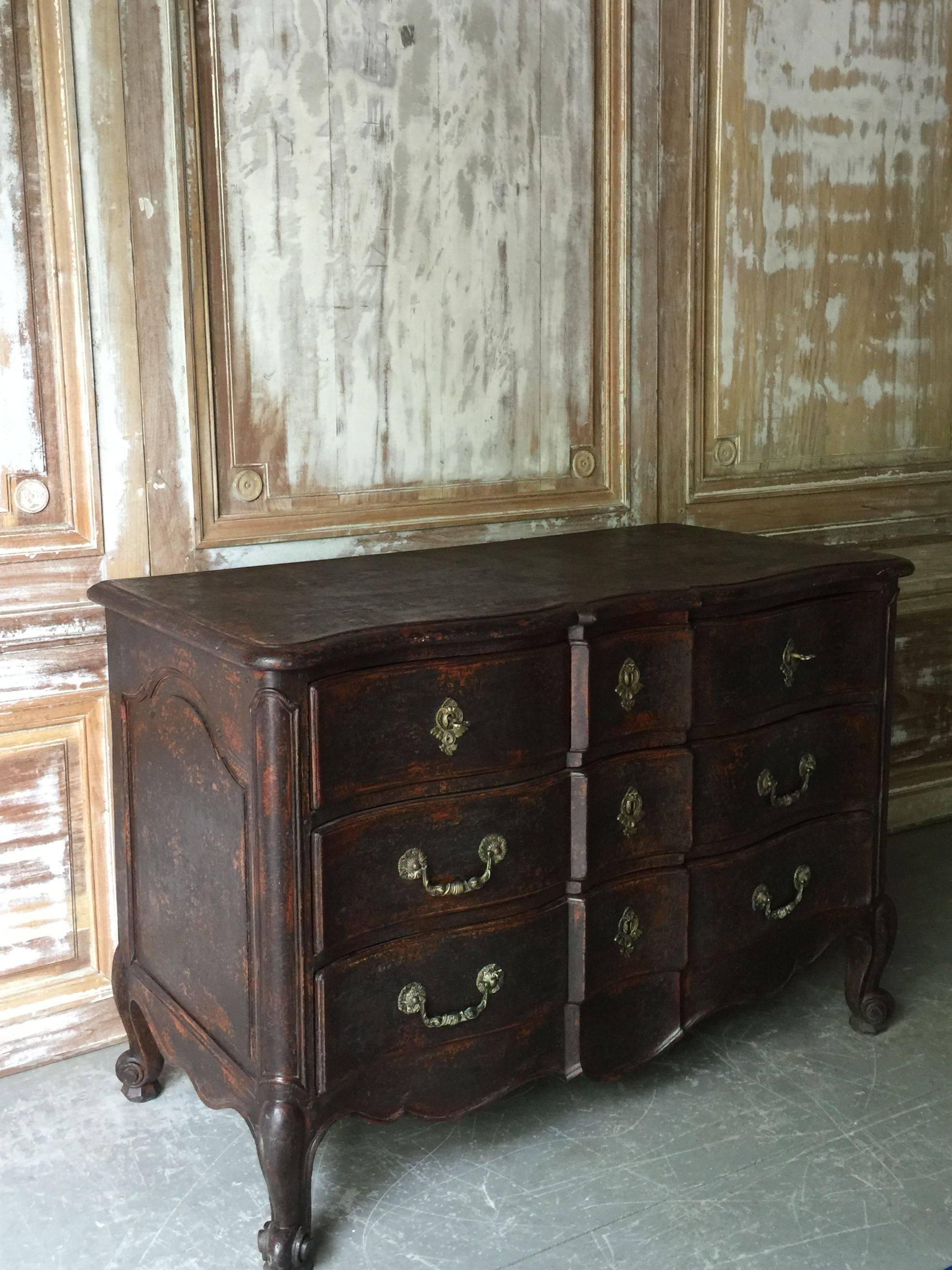 An exquisite and richly carved serpentine fronted French commode from the early 19th century Louis XV style in original worn patina.
France, circa 1810.

Here are few examples surprising pieces and objects, authentic, decorative and rare items