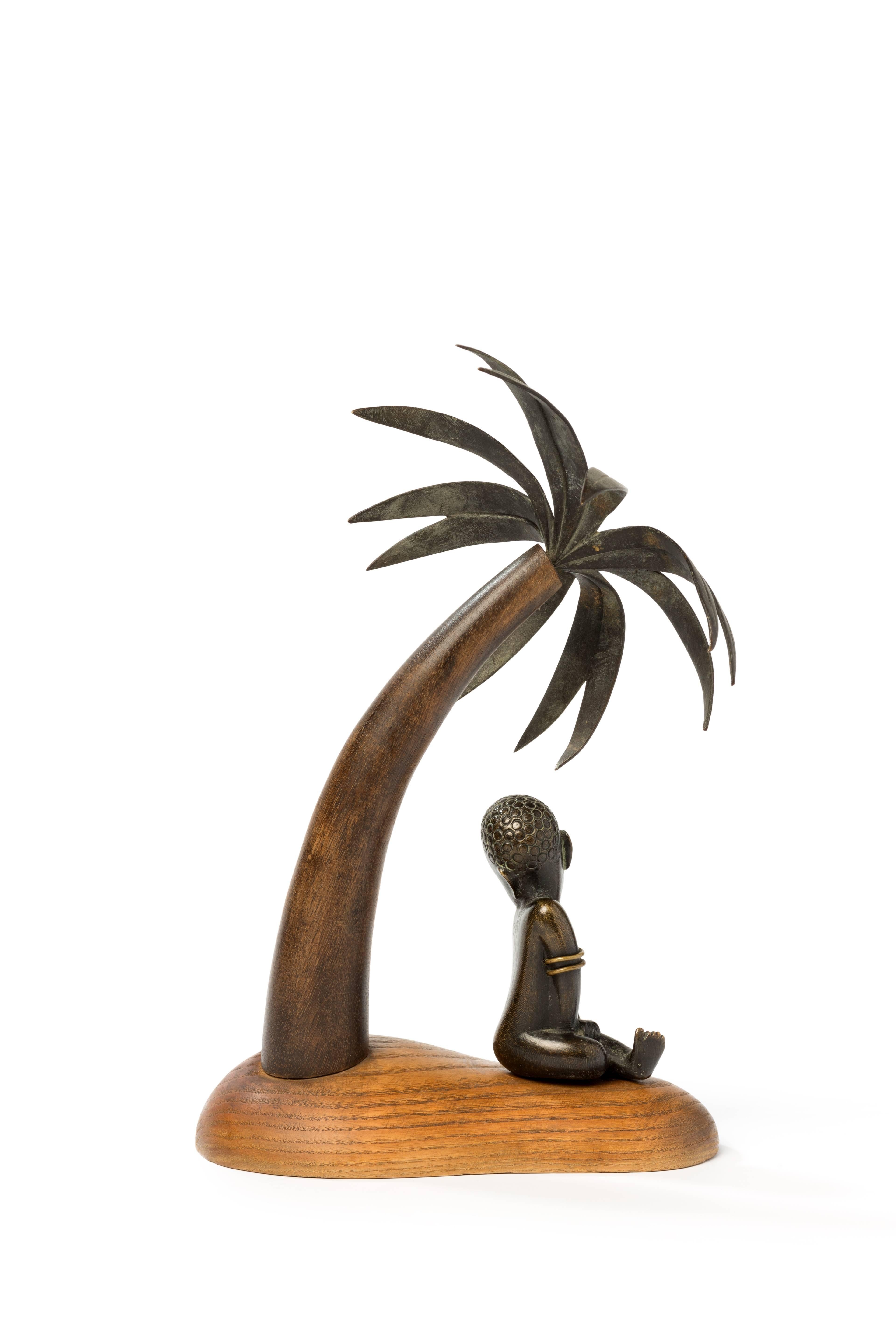 Art Deco figure, circa 1940. Designed and made by Hagenauer Werkstätte, Vienna. Brass, dark brown patinated, wood.
Measurements: Height: 9.84 in ( 25 cm ), Width: 3.54 in ( 9 cm ), Depth: 6.3 in ( 16 cm ).
 