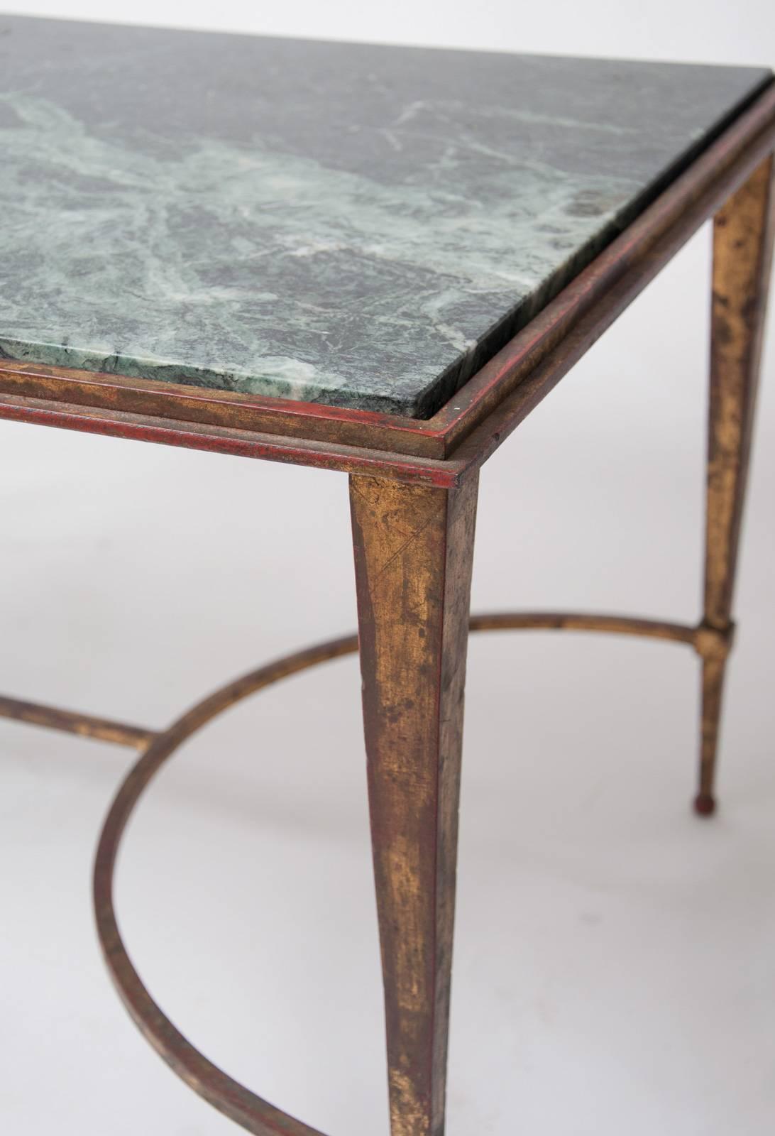 Gilded wrought iron low table with verde antico marble top attributed to Maison Ramsay,
Paris, France, circa 1950.