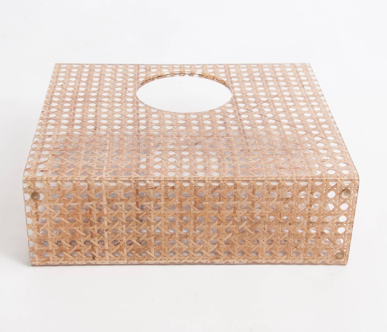 Small and stylish 1970s magazine holder made from Lucite with embedded rattan cane work. Attributed to Christian Dior Home collection possibly designed by Gabriella Crespi.