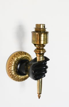 Pair of French hand and torch wall sconces, in the manner of André Arbus
