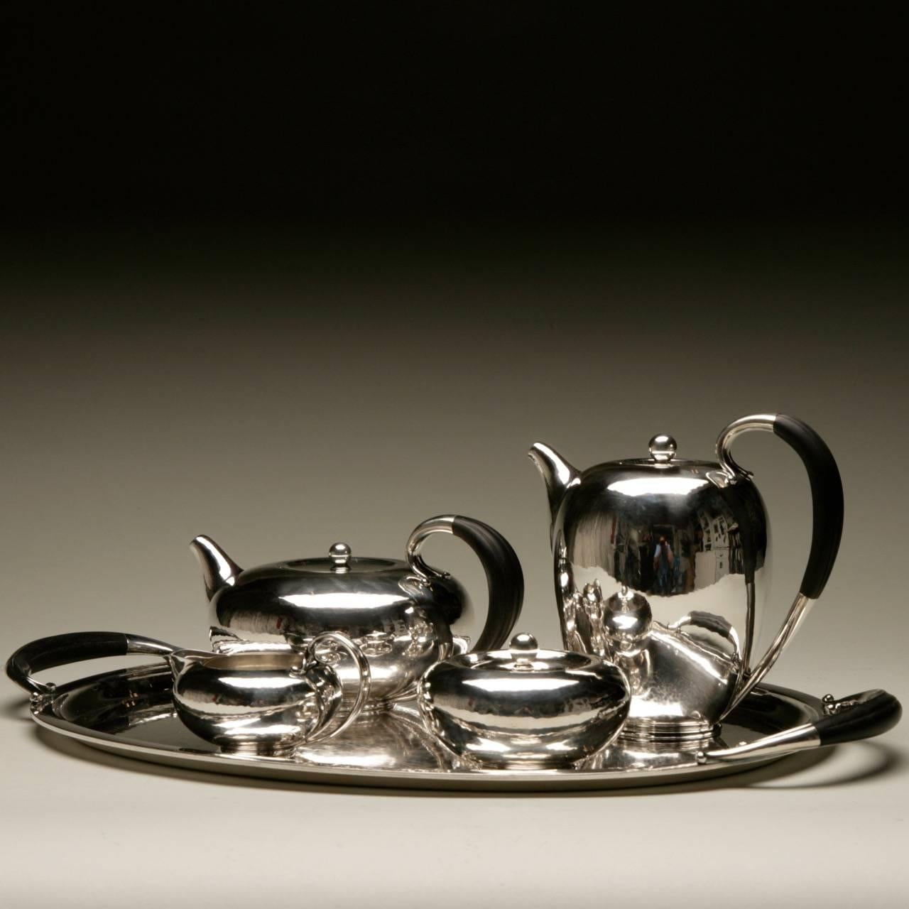 Georg Jensen sterling silver Art Deco coffee and tea service no.787 by Johan Rohde

 

A lovely Art Deco service with a low slung bodies having a contemporary Japonesque feel. Designed by Johan Rohde in 1933. Rare to find with matching tray.