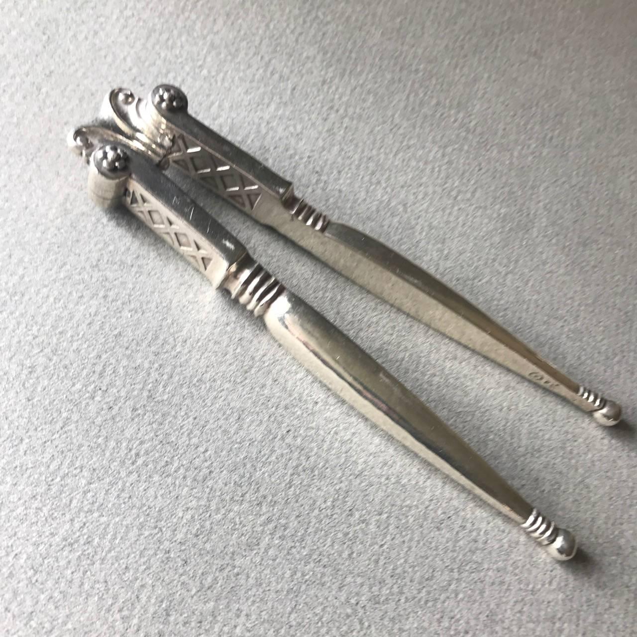 Georg Jensen 830 silver nut crackers no. 134
Can also be used as a Lobster Cracker.

Hand-forged from solid 830 silver. Extremely heavy. Exceptional details. Designed by Johan Rohde,

circa 1919-1927

About the designer:
Johan Rohde