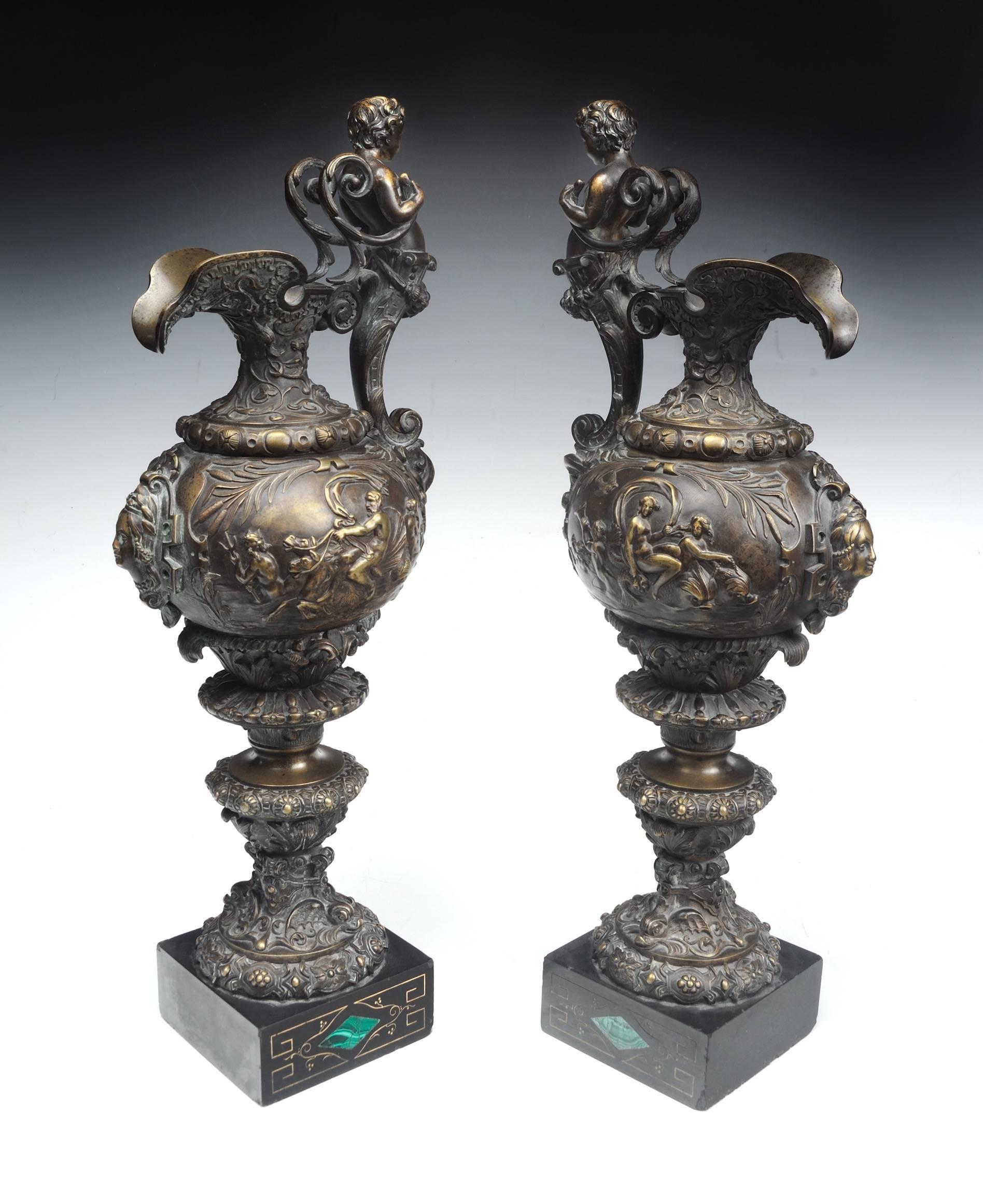 "Large 19th Century French Patined Bronze Ewers"  
France ca. 1880
Cast Bronze with Granite Bases
21" x 8" x 6.5" inches