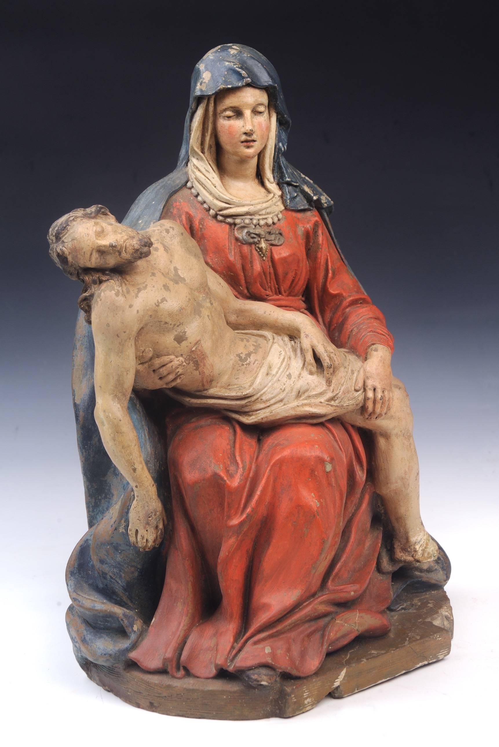 16th century Pieta, of the seated virgin holding the body of the dead Christ, circa 1580 Follower: Jacopo Sansovino (Italian 1486-1570)
Polychrome terracotta 
Measures: 16