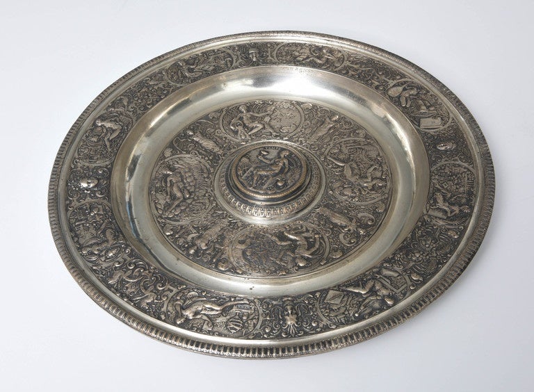 The rosewater dish is a replica of the 16th century French mannerist pewter original cast from a mould by Francois Briot of Montbeliard, France and now in the Victoria and Albert Museum in London. Originally this salver was used to catch rosewater