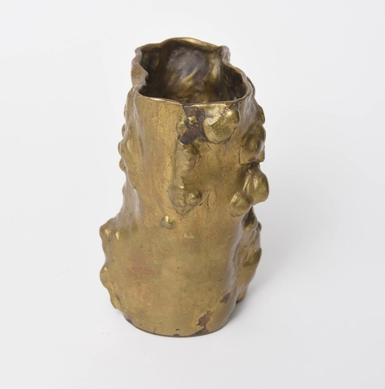 This organic form gilt bronze vase resembles a hollowed out tree trunk ("Tronco") and according to her site, it is a tribute to the "metaphoric and aesthetic qualities of the natural world." It resembles some Chinese or Japanese