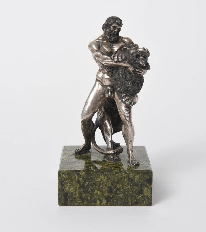 This small silver sculpture of Hercules and the Nemean Lion is based on a 2nd-3rd century Roman marble in the State Hermitage Museum in Saint Petersburg, Russia. It bears a Russian Kokoshnik mark indicating .875 silver content with production in