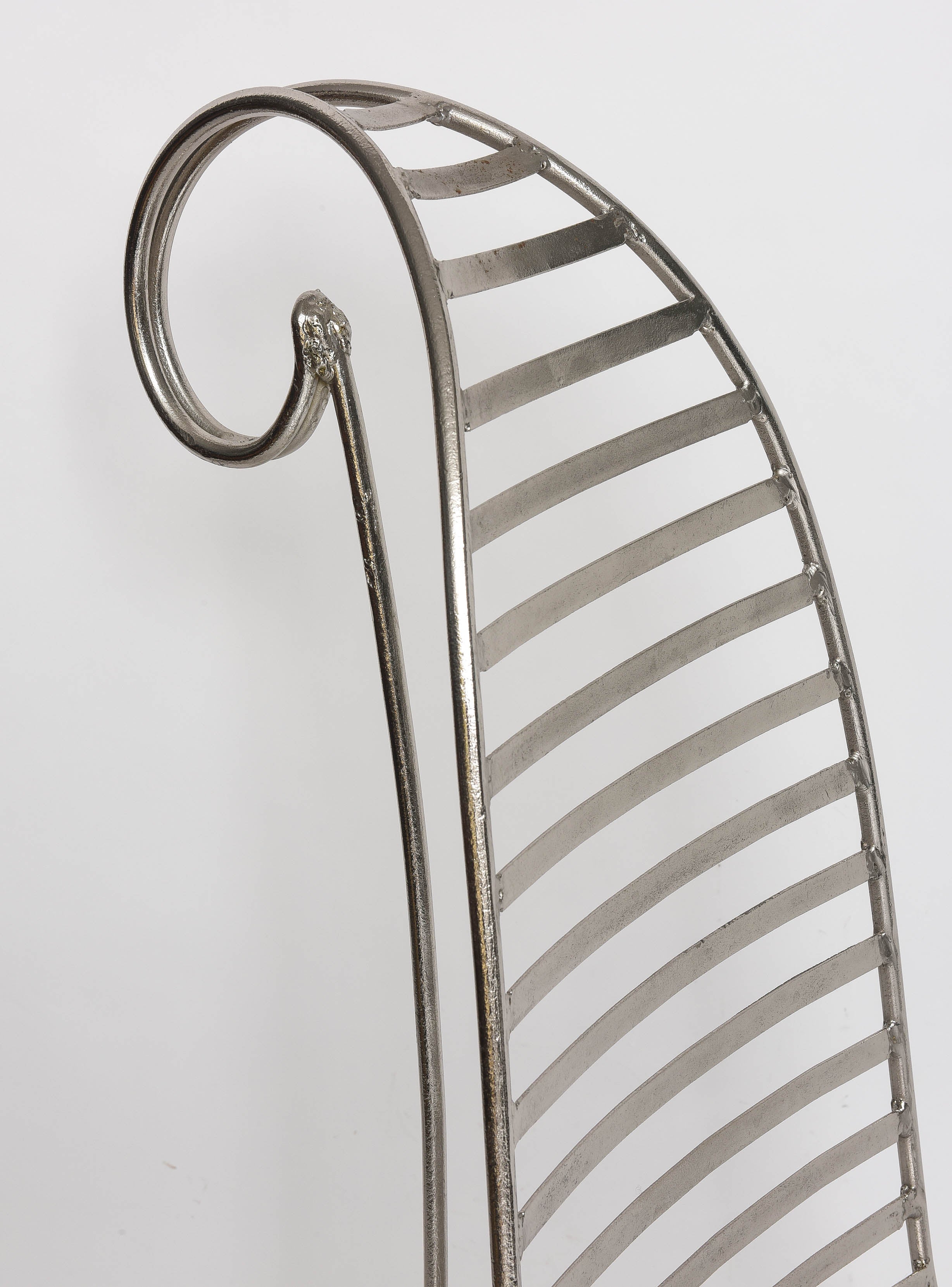 This attractive chromed version of the iconic spine chair by a follower of André Dubreuil was acquired in Miami in the 1990s.