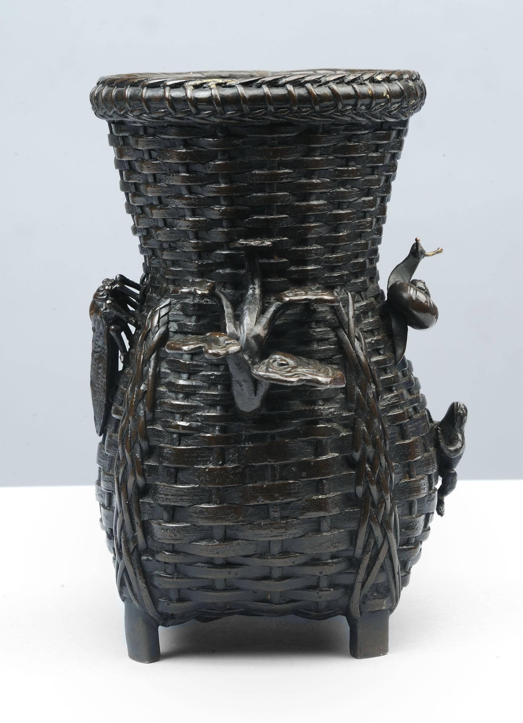 This rare and unusual pair of Meiji era (1868-1911) basket weave bronze vases is decorated with a crickets, frogs and snails. Fine condition with beautiful patination.