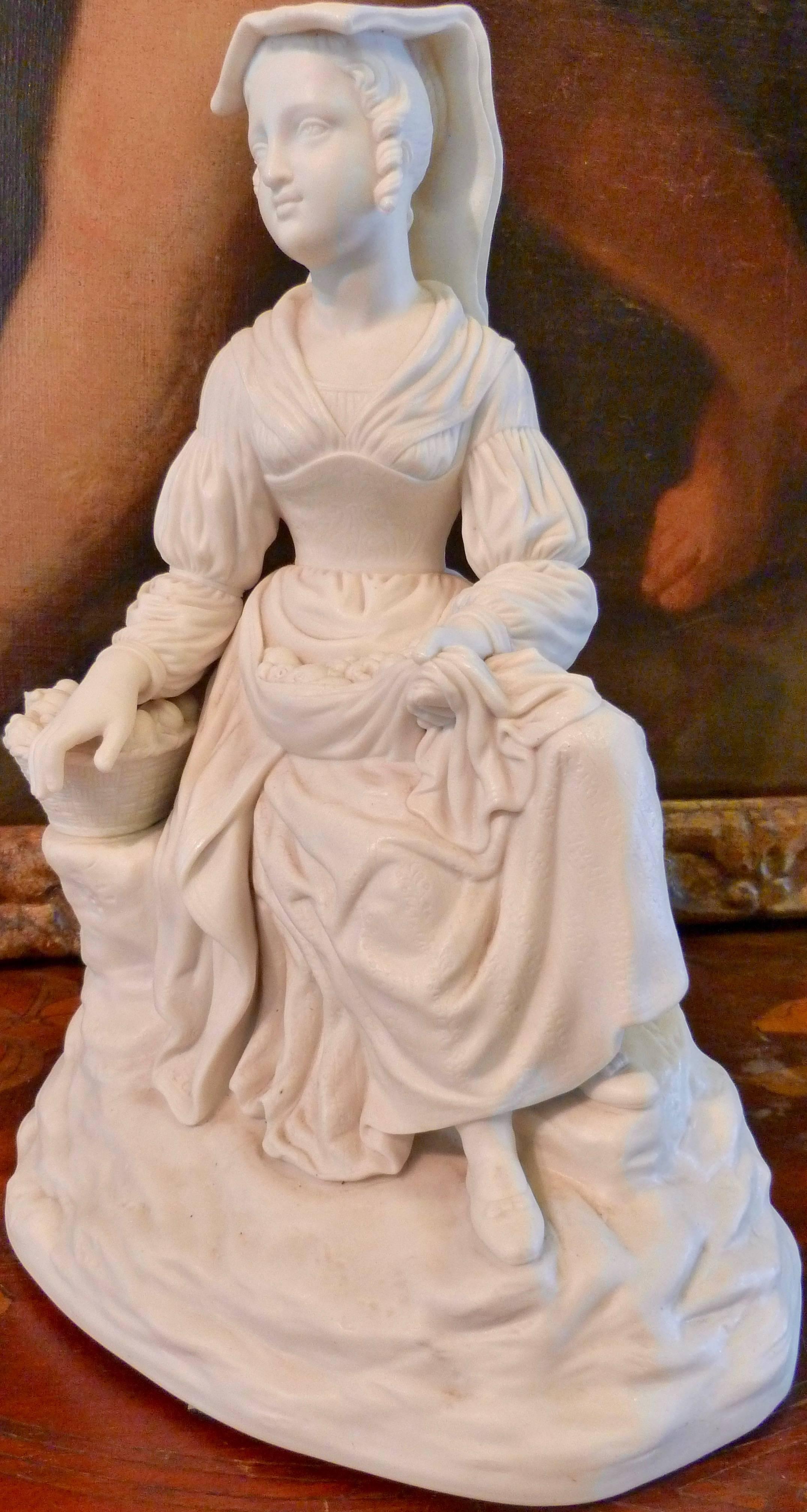 An exquisite and very detailed English grand tour Parian ware figure of an Italian fruit seller, late 19th century.