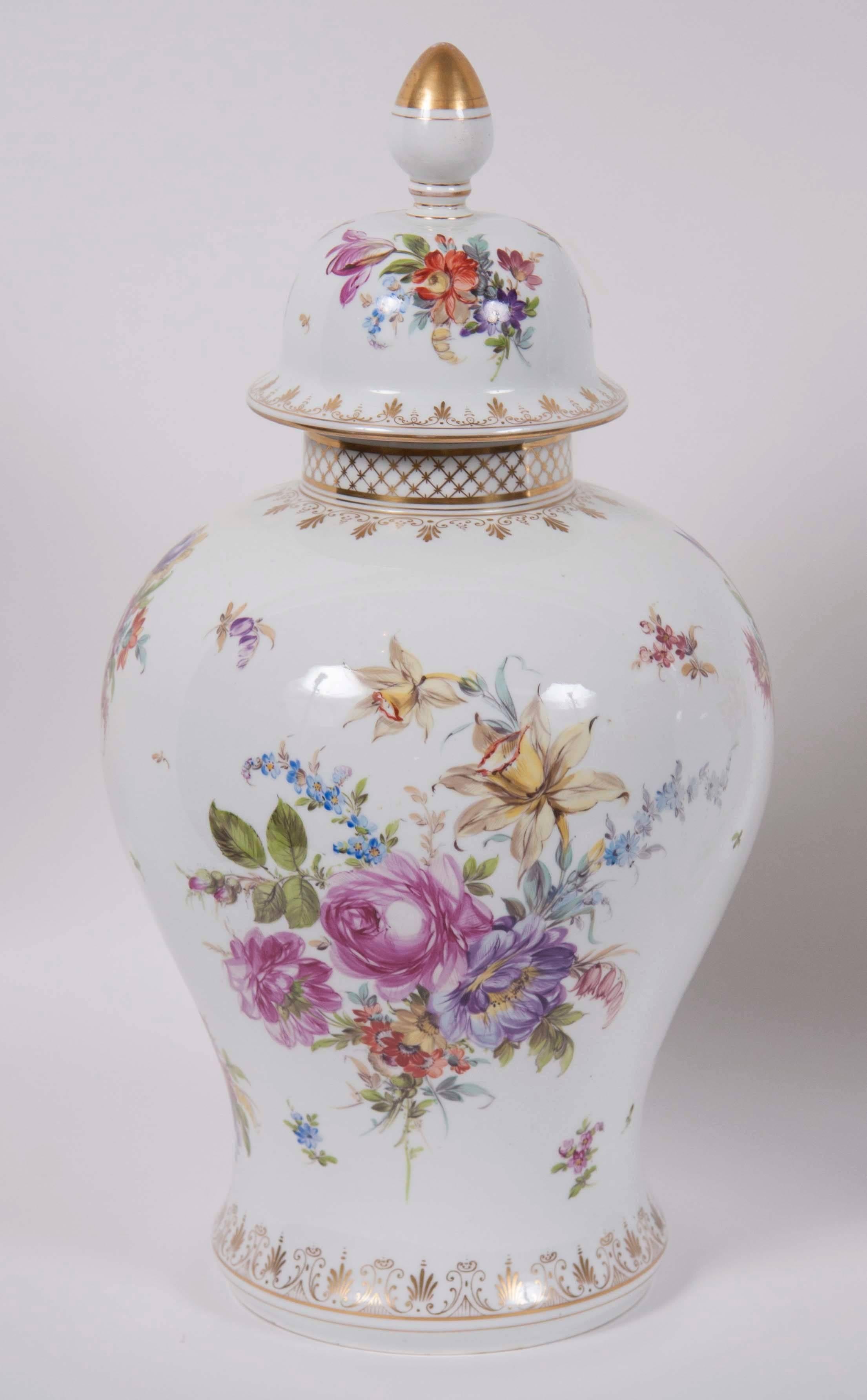 A pair of porcelain covered jars decorated with floral bouquets. The jars bear the mark of the German factory of Carl Thieme of Potschappel (Dresden), which was active in the third quarter of the 19th century.