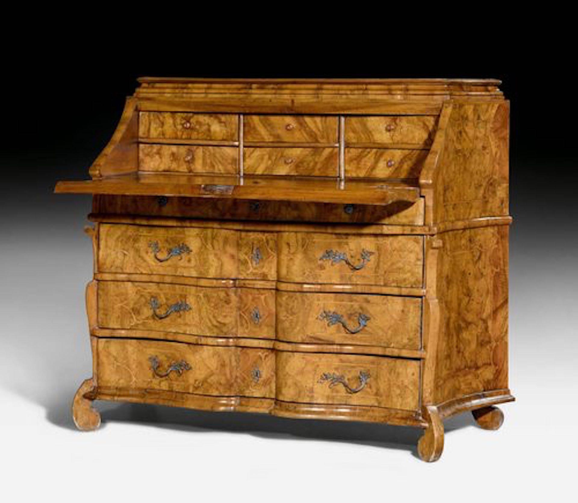 Baroque bureau cabinet or desk,

Baroque, Northern Italy, Lombardy, circa 1720.

Walnut burl wood and fruitwood veneer and inlaid with reserves and fillets. Front with hinged writing surface over four drawers. Inner compartment with six drawers