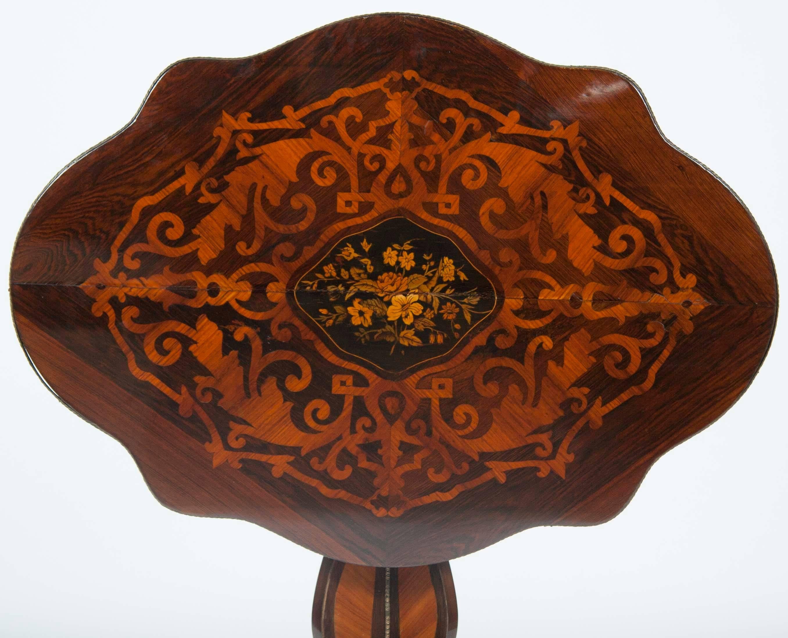 A late 19th century French Napoleon III period flower inlaid and bronze-mounted tilt top table.