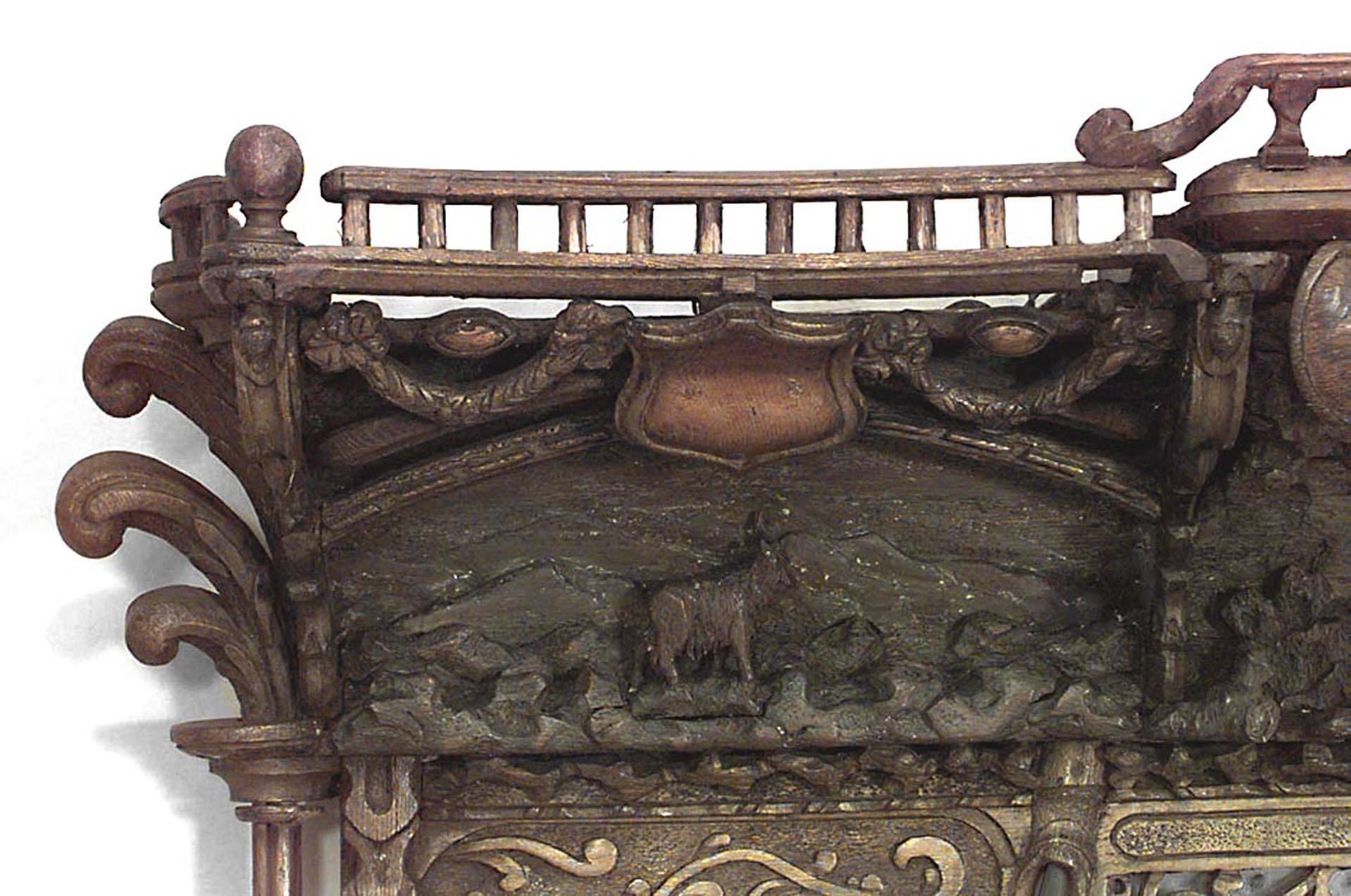 Rustic Continental (19th Century) carved oak horizontal three-section wall mirror with two carved dogs.
