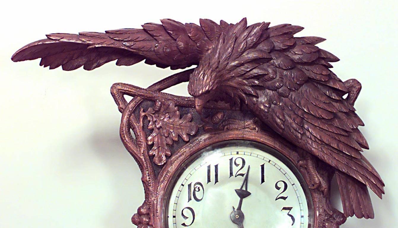 Rustic Black Forest (19th Century) walnut wall clock with carved floral decoration and bird pediment with 5 shelves. (Not working)
