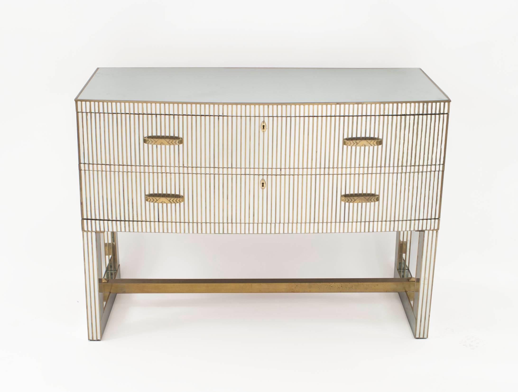 Pair of French midcentury (1950s) bow front mirrored chests with two drawers having a fluted bronze trim design with bronze handles and a bottom stretcher.