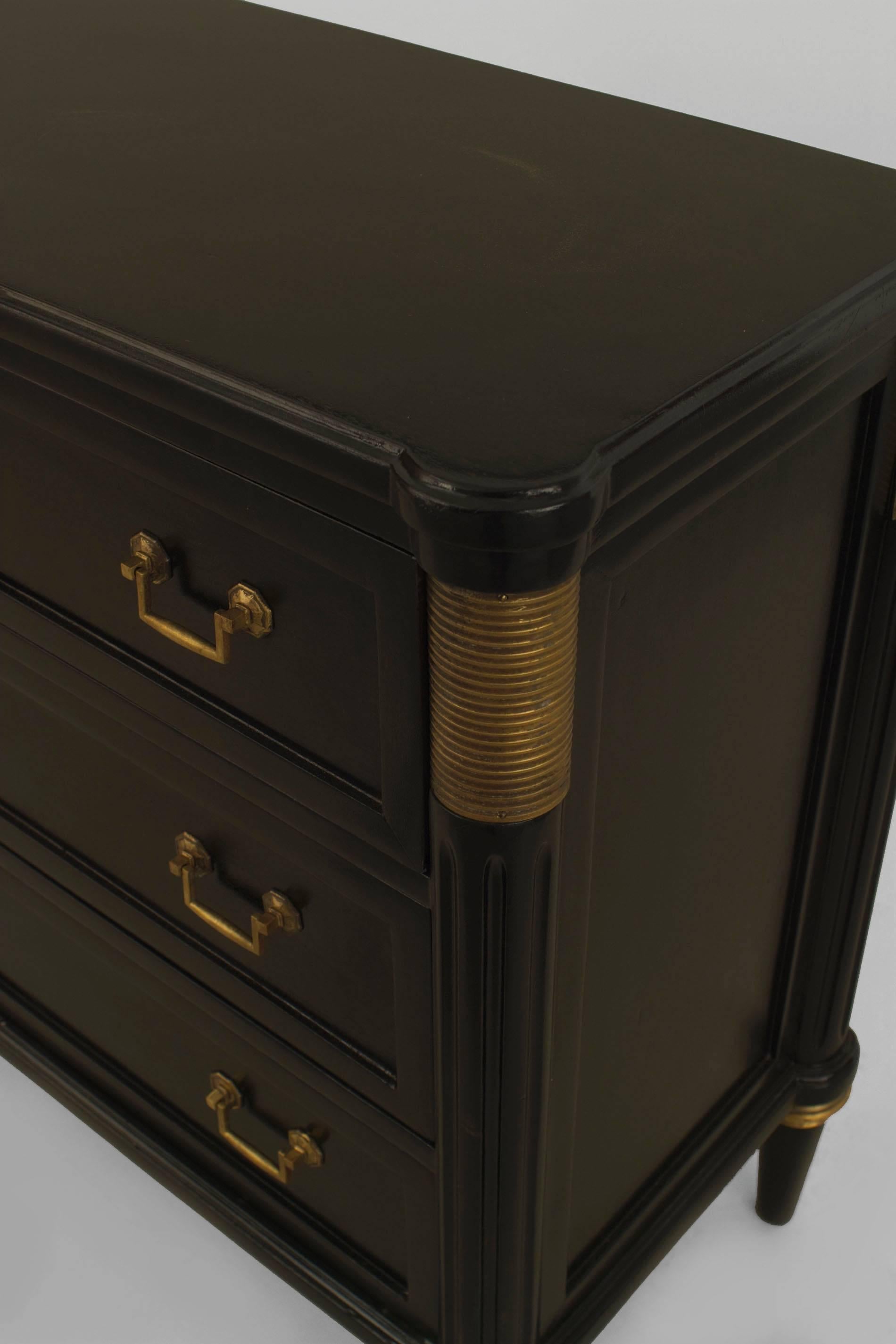 Pair of French 1940s (Louis XVI style) ebonized chests with bronze trim on
sides and legs with 3 drawers having a pair of handles on tapered round legs (att: JANSEN).