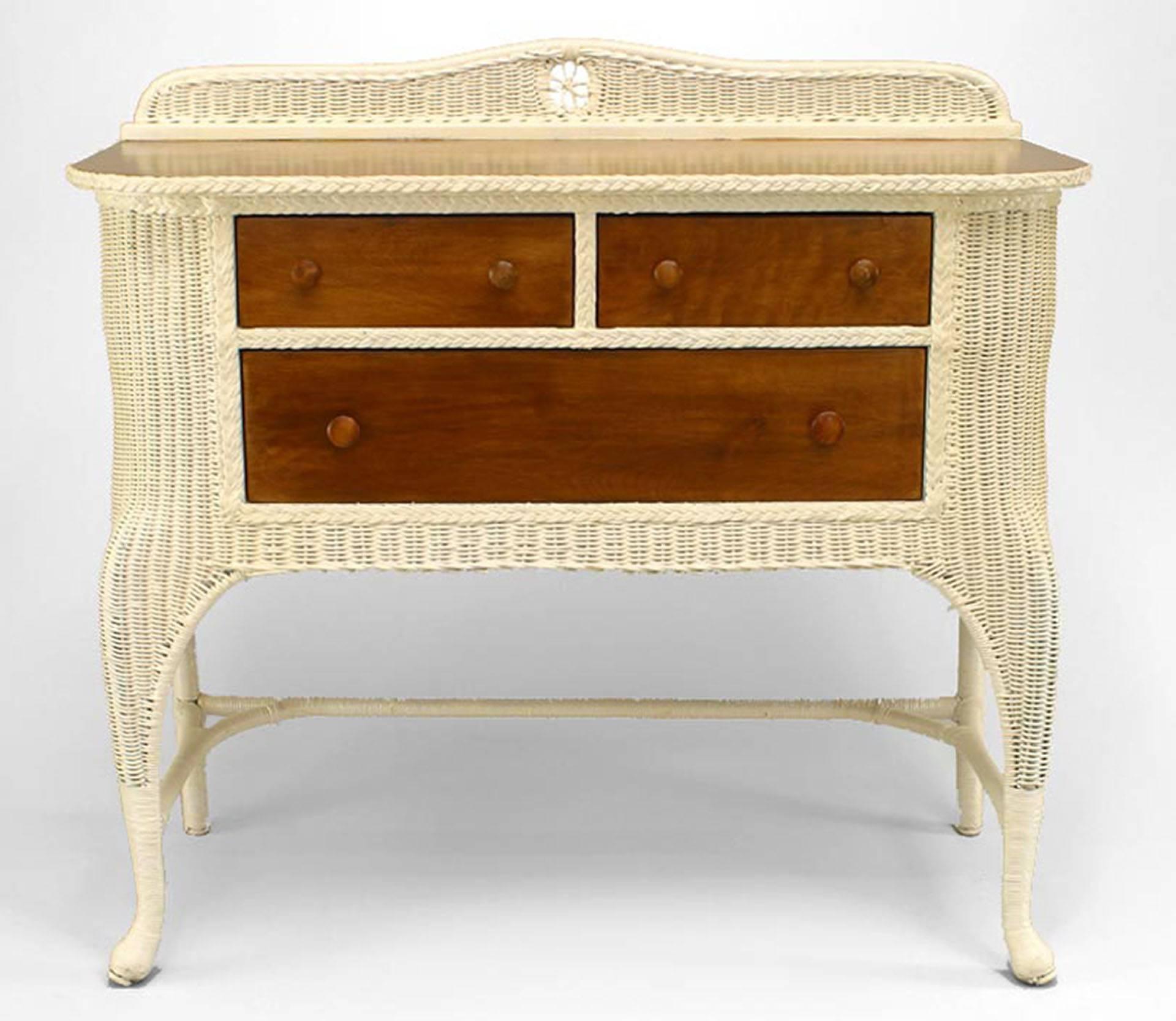 American Victorian white painted wicker sideboard with woven backrail and
cabriole legs with stripped maple drawers and top.