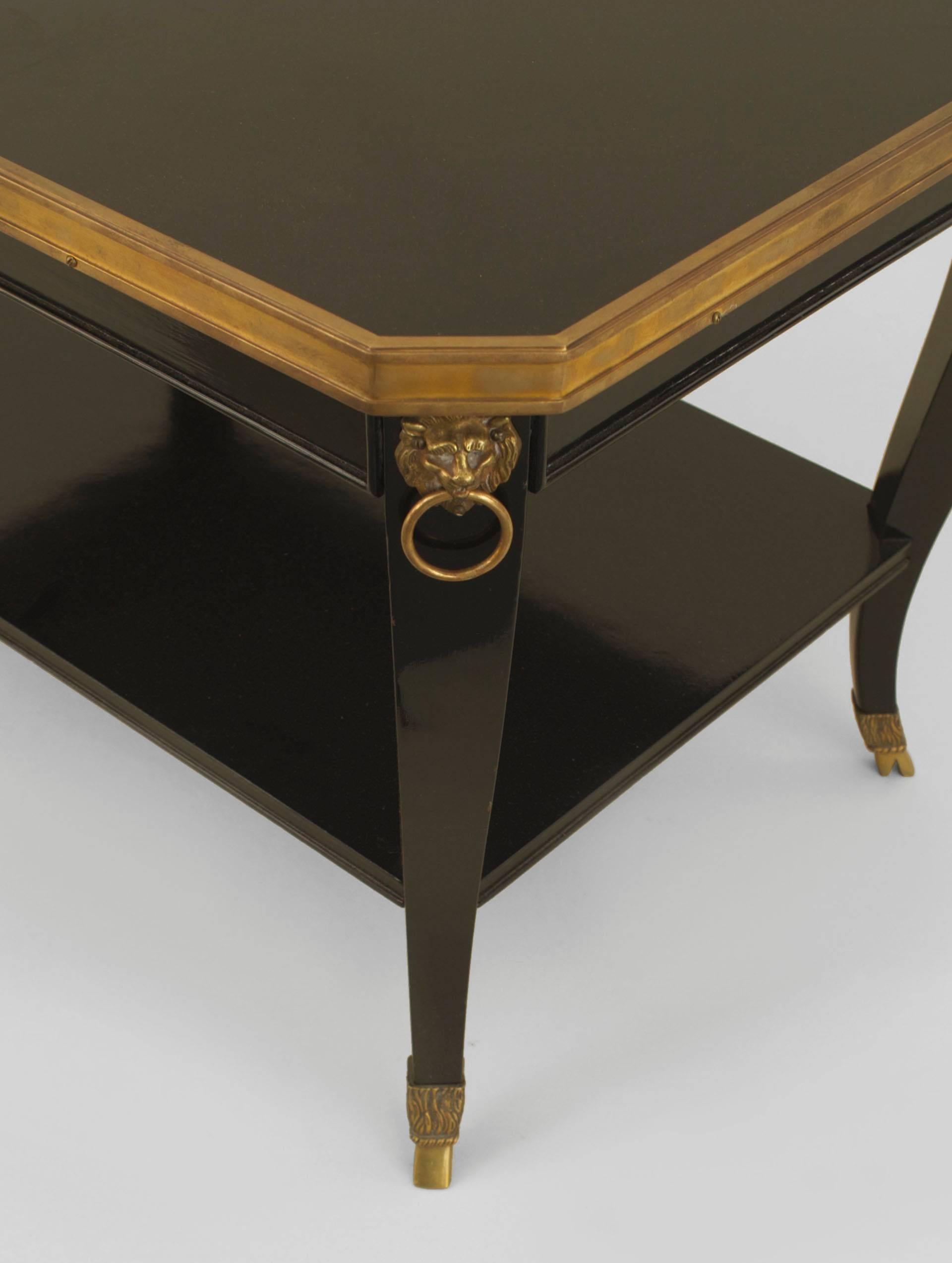 French 1940s (Regency style) ebonized rectangular top coffee table with a shelf and bronze top edge with lion head trim and hoof feet (stamped: JANSEN).