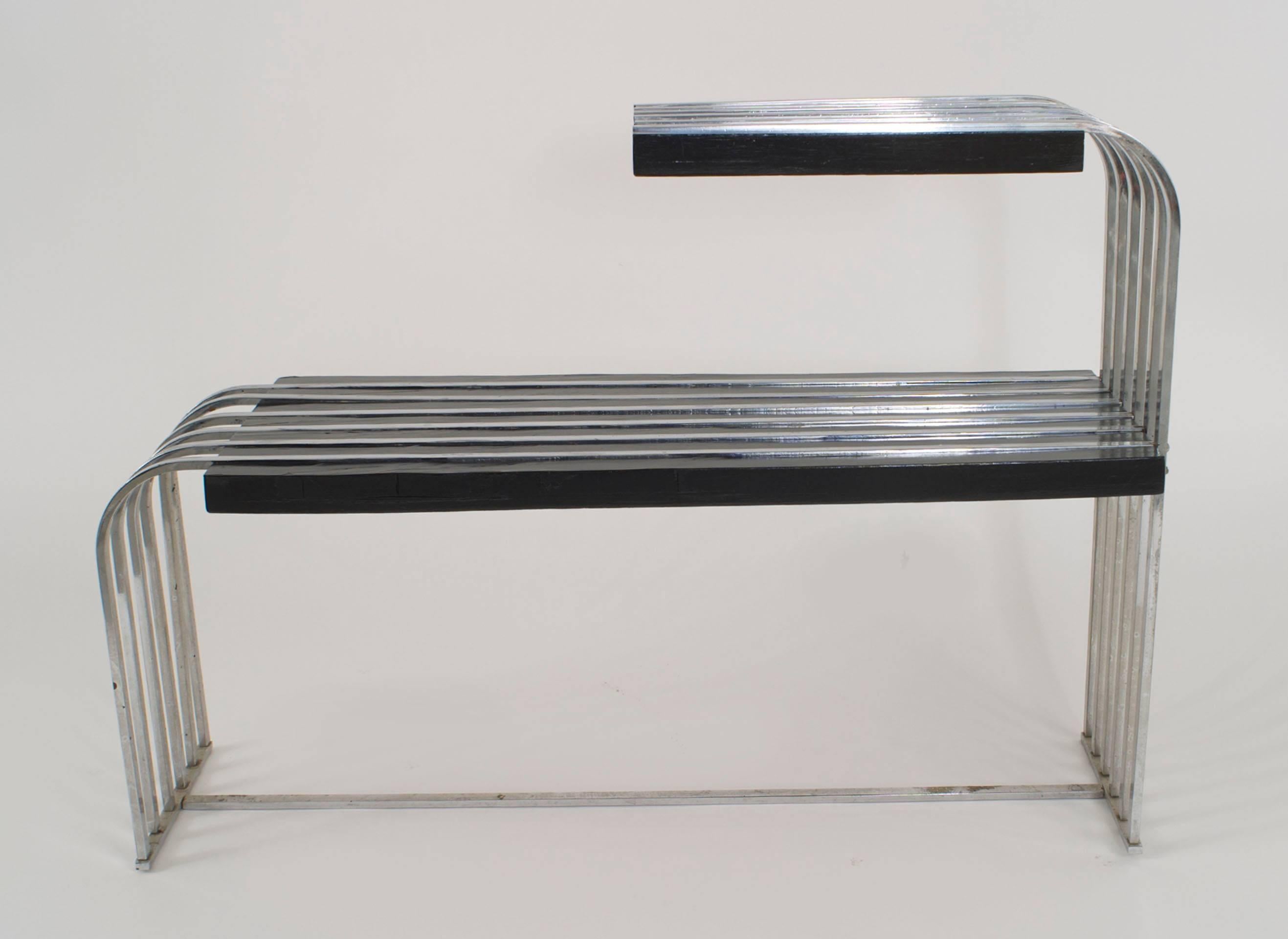 American Art Deco (1930s) black lacquered and chrome 2 tier end table with curved sides and a chrome stretcher.
