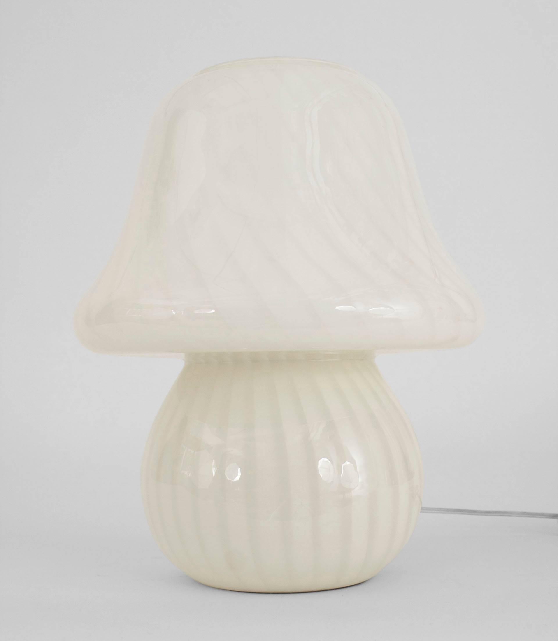 Pair of Mid-Century Italian Murano swirl design white glass table lamps having a round ball base under a mushroom shape shade with an open top.