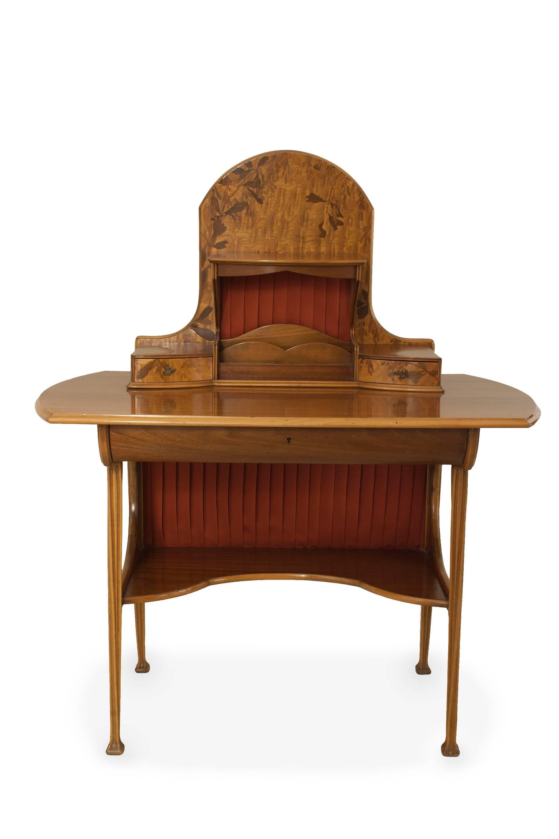 French Art Nouveau dressing table / writing desk with a floral inlaid arch top upper structure having a shelf & letter slats between 2 small drawers (Manner of MAJORELLE)
