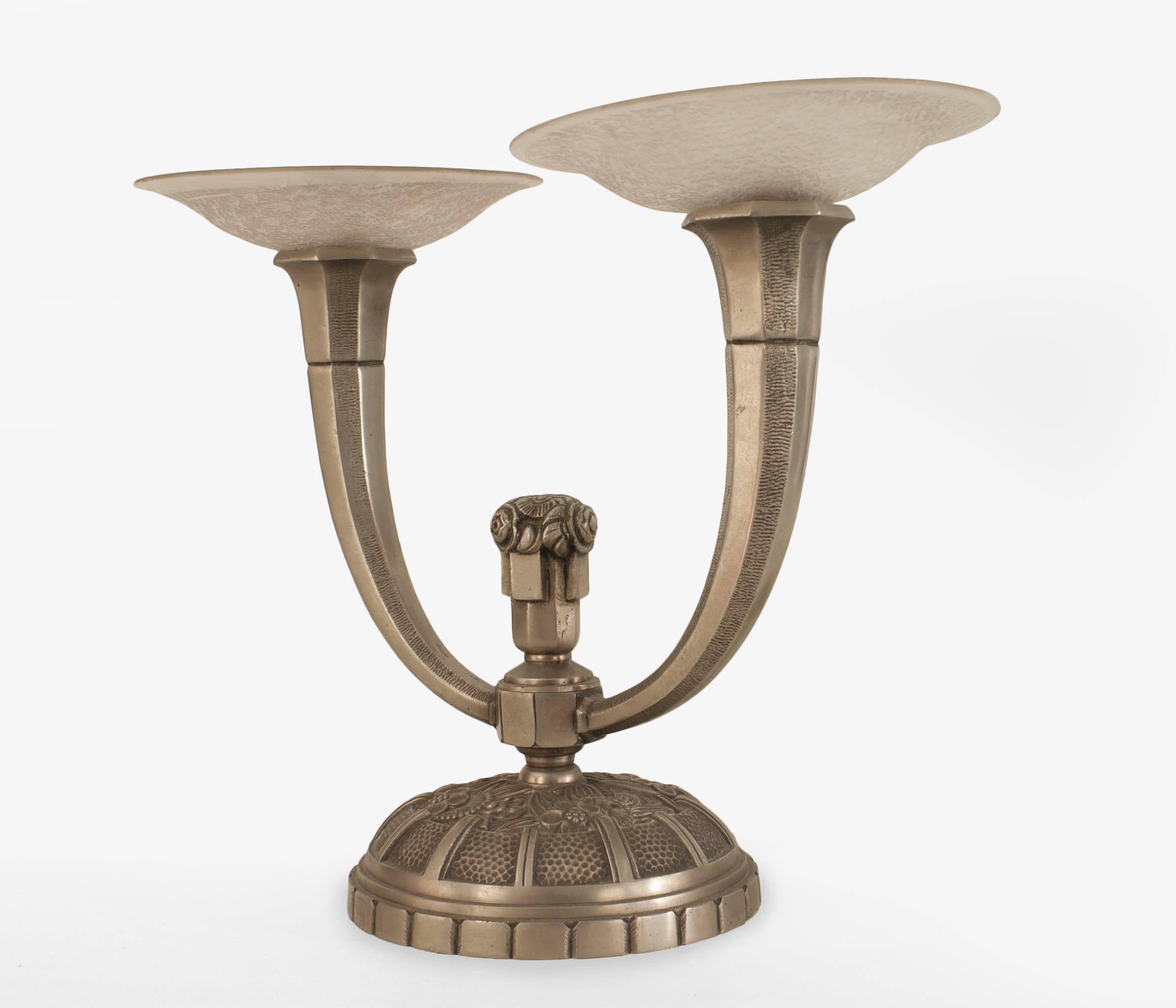 Pair of French Art Deco nickel plated 2 arm candelabra (wired) with center finial and round base having a floral design and supporting textured frosted glass round bobeches (signed MULLER FRERES)(PRICED AS Pair)
