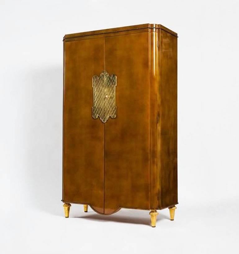 French mid-century light brown lacquered Atelier Sain et Tambuté, Paris two-door armoire cabinet with bronze rope trim and door lock plate on gilt cylindrical feet with a Siena marble top (Andre Arbus - Gilbert Poillerat) ref: ARBUS, by Brunhammer,