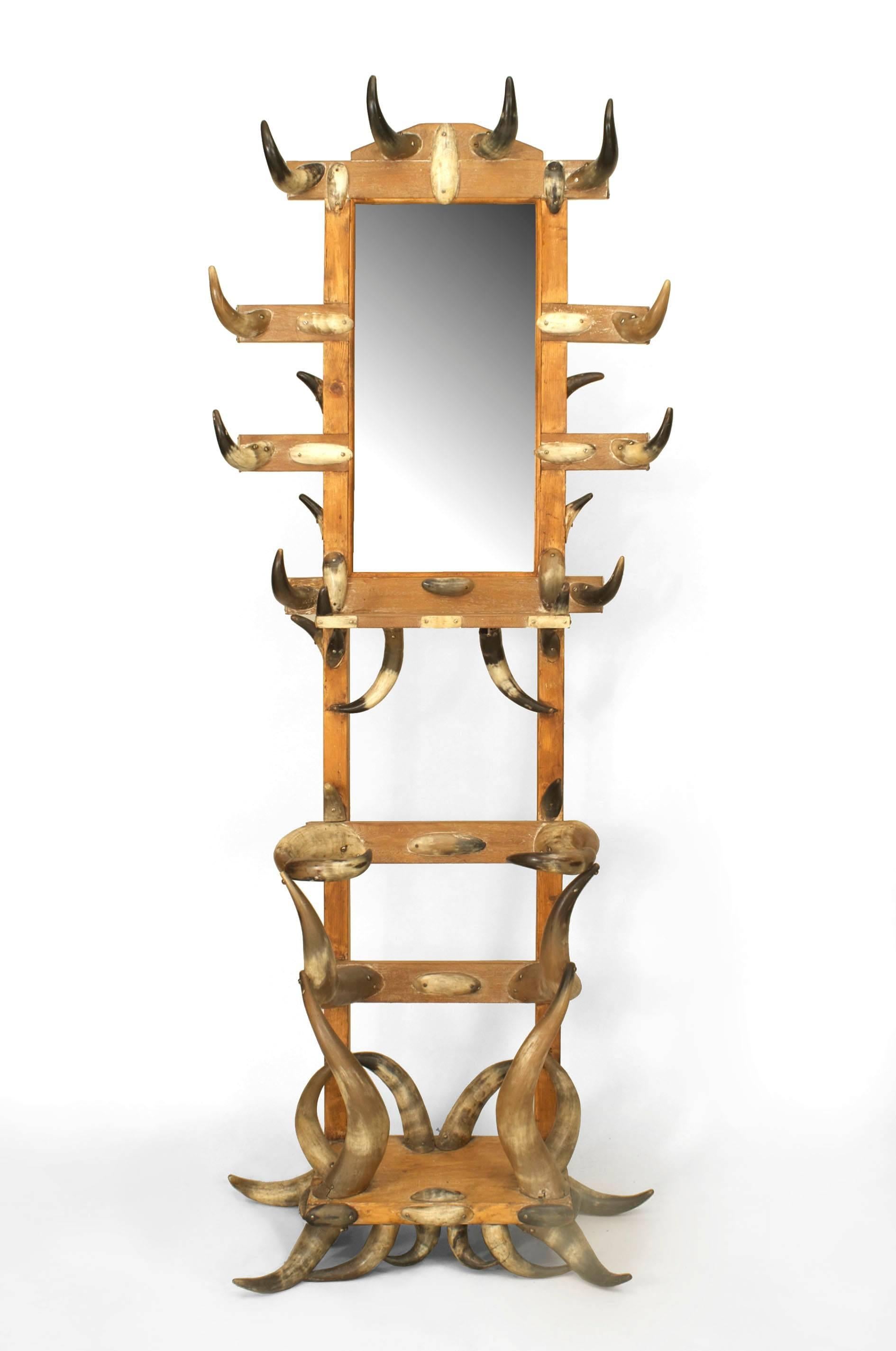 American Victorian steer horn and stripped pine hatrack/umbrella stand with a shelf and mirror.
  