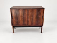 Low sideboard in rosewood with sliding doors. Denmark, 1960s