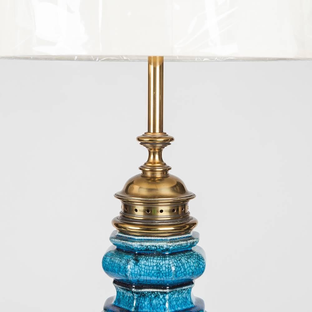 Stunning pair of large table lamp in a crackled blue glazed ceramic with brass detail. By Stiffel, circa 1967. Retain Stiffel label. Linen shades not included, sold separately $120.