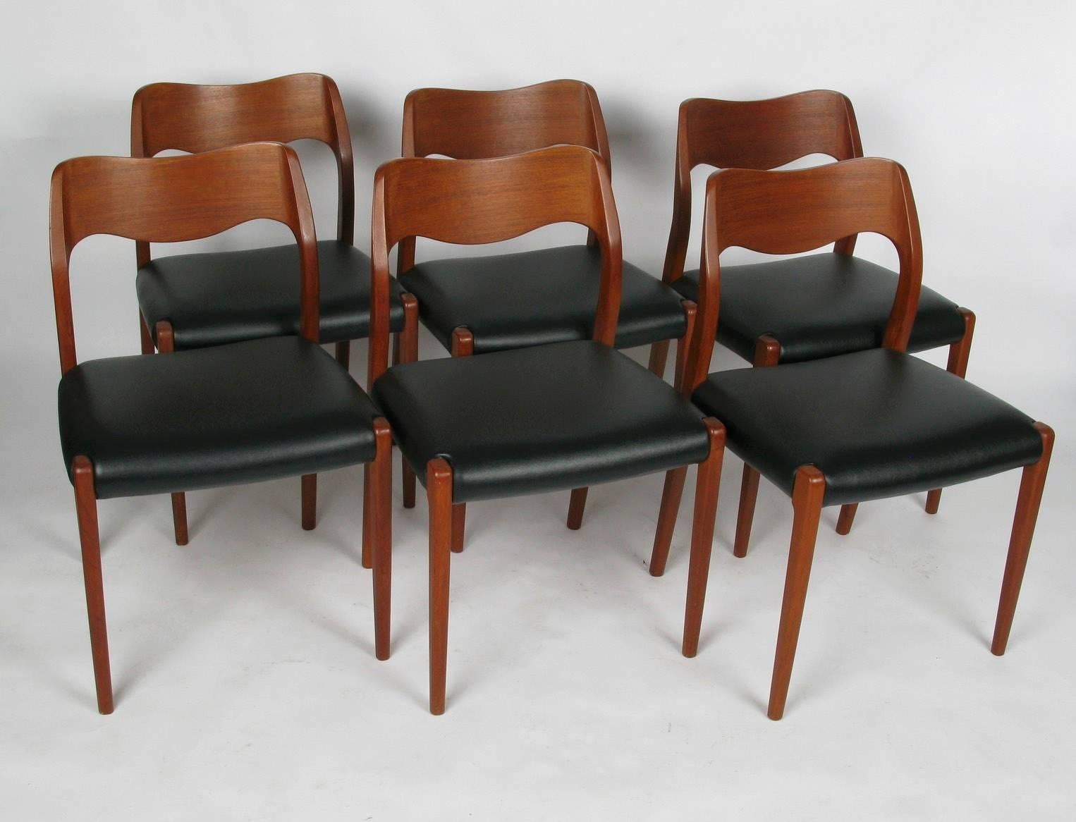 Set of eight 1960s teak dining chairs (2 #55 armchairs & 6 #71 side chairs) from Denmark by Niels Moller for J. L. Moller. New seat upholstery.
Side chairs measure: 19.5