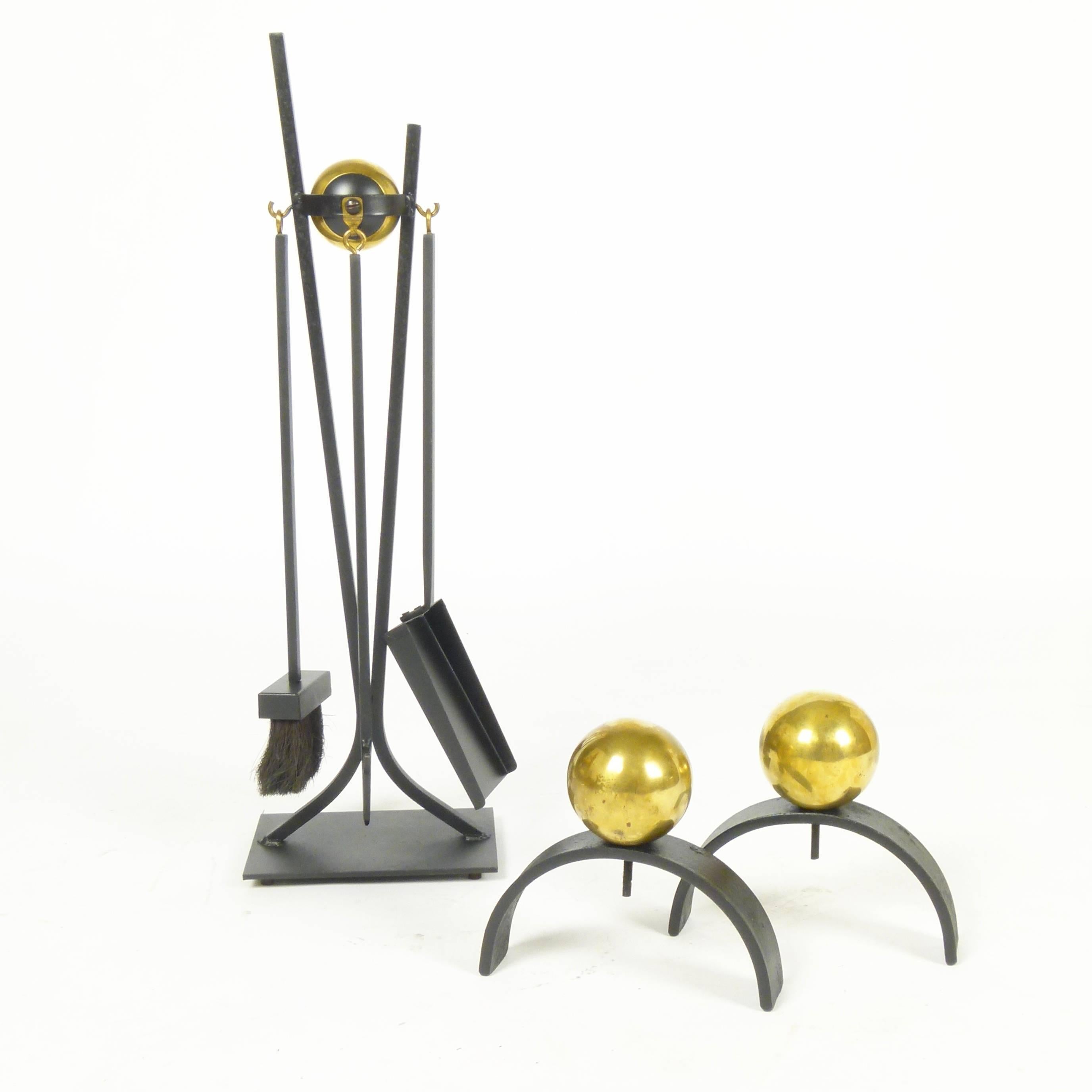 Brass and iron fireplace tools and andiron set often attributed to Donald Deskey.
Measurements: Tools measure 30.5