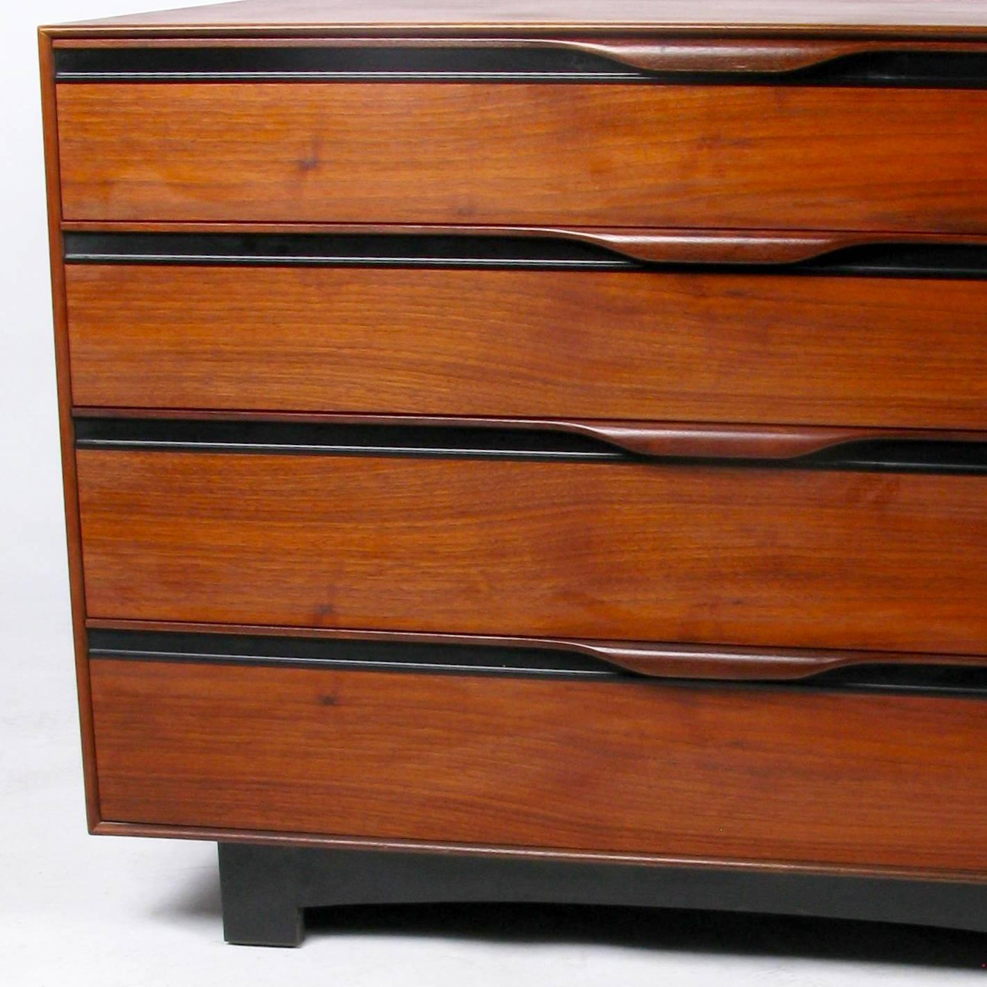 Pair of early 1960s oiled walnut chests designed by John Kapel for Glenn of California, distributed by John Stuart. Would work beautifully together as one long dresser or separately as nightstands.