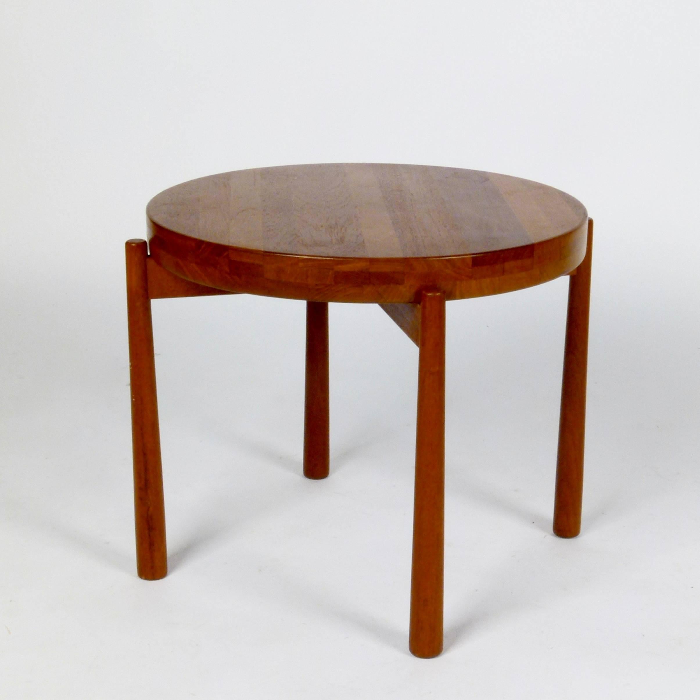 Beautifully crafted, 1960s solid teak table with flip-top and reverse tapered legs designed by Jens Quistgaard for DUX of Sweden.