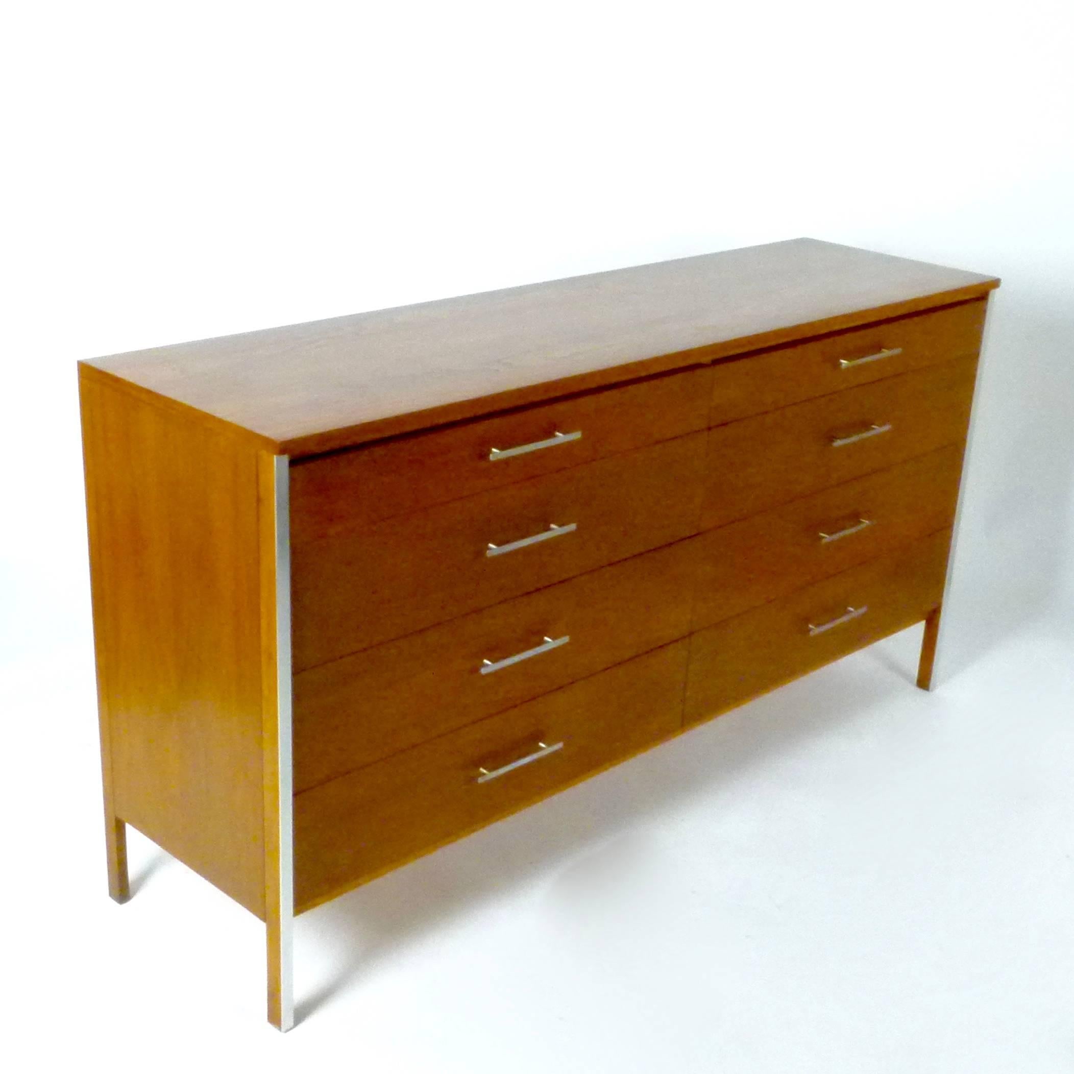 1960s eight-drawer dresser in walnut with aluminium detail and pulls by Paul McCobb from his Calvin line. Restored top.