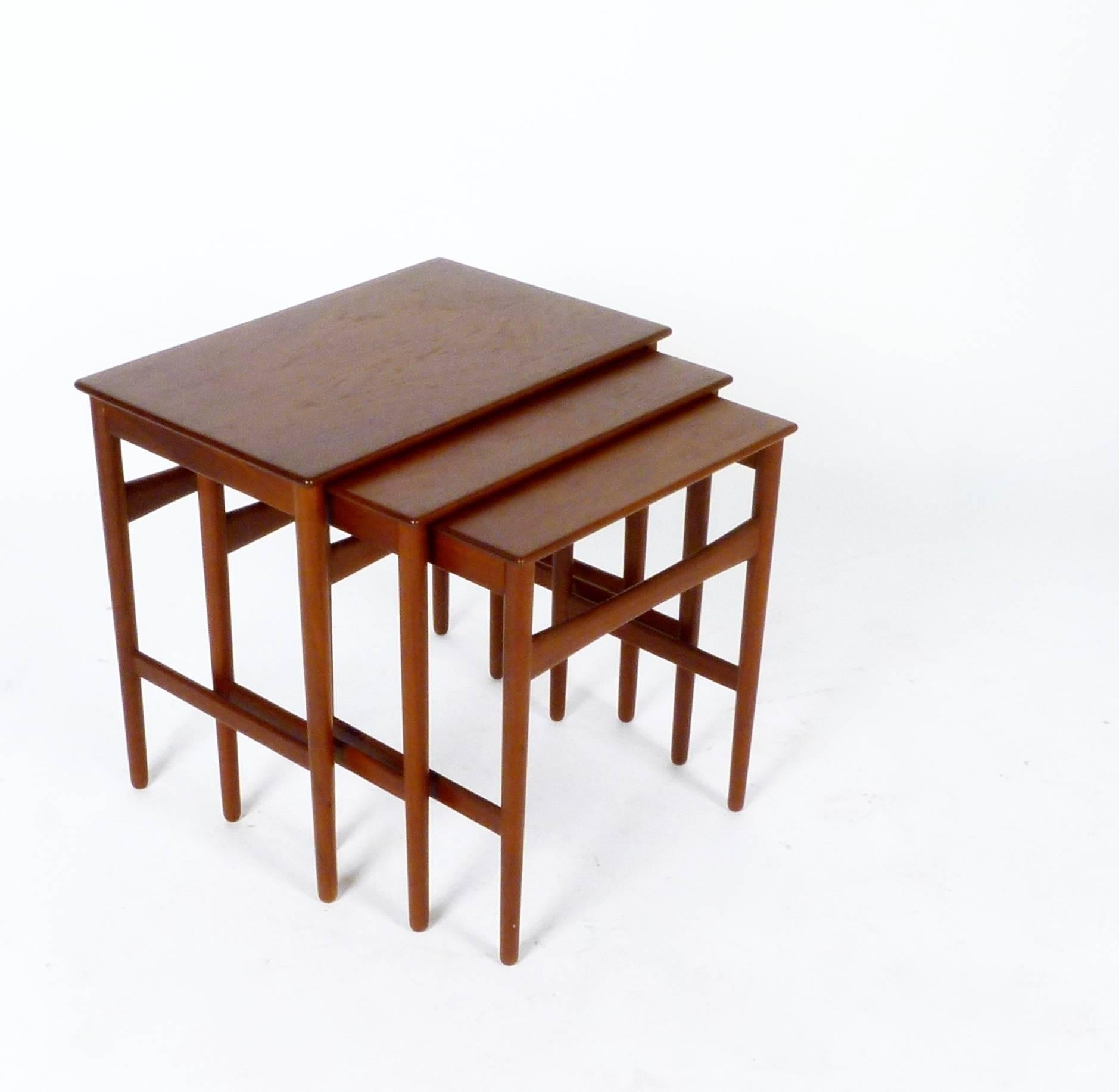 Set of three circa 1958 teak nesting tables from Denmark by Hans Wegner for Andreas Tuck.